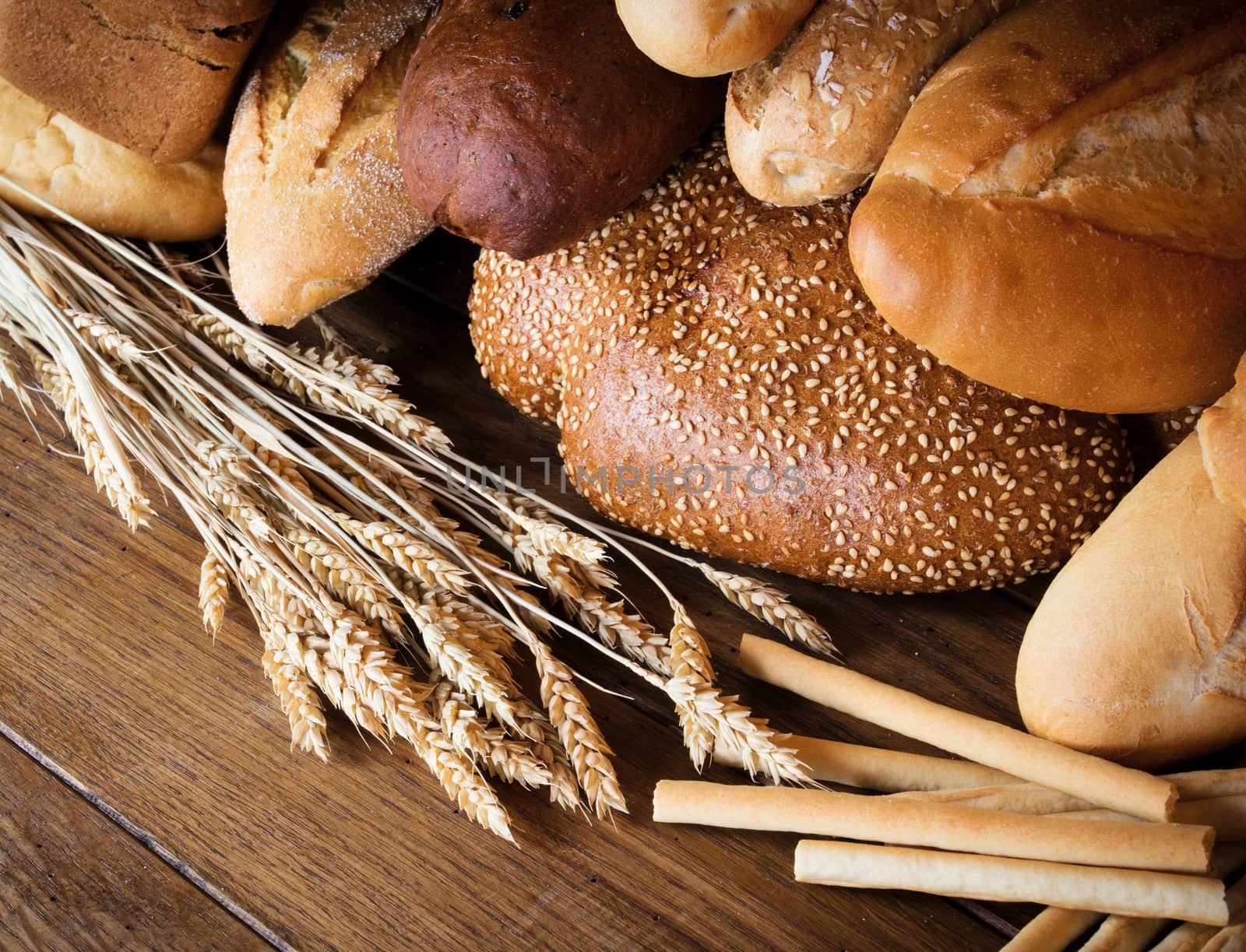 Assortment of bread on wooden background