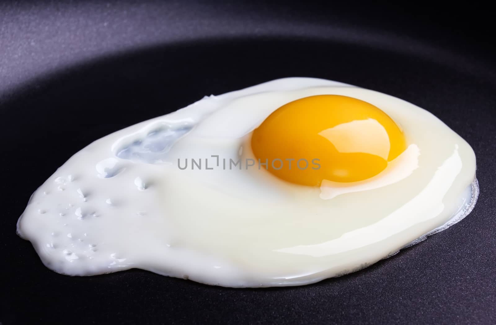 Fried egg on frying pan