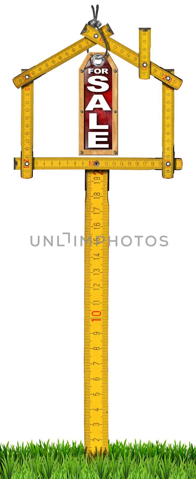 Yellow wooden meter ruler in the shape of house and label with text for sale. For sale real estate sign isolated on white background with green grass