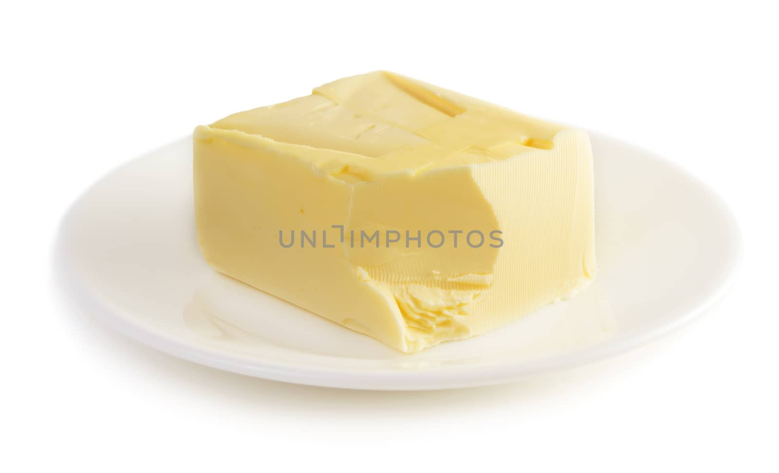 Butter on plate isolated on white background