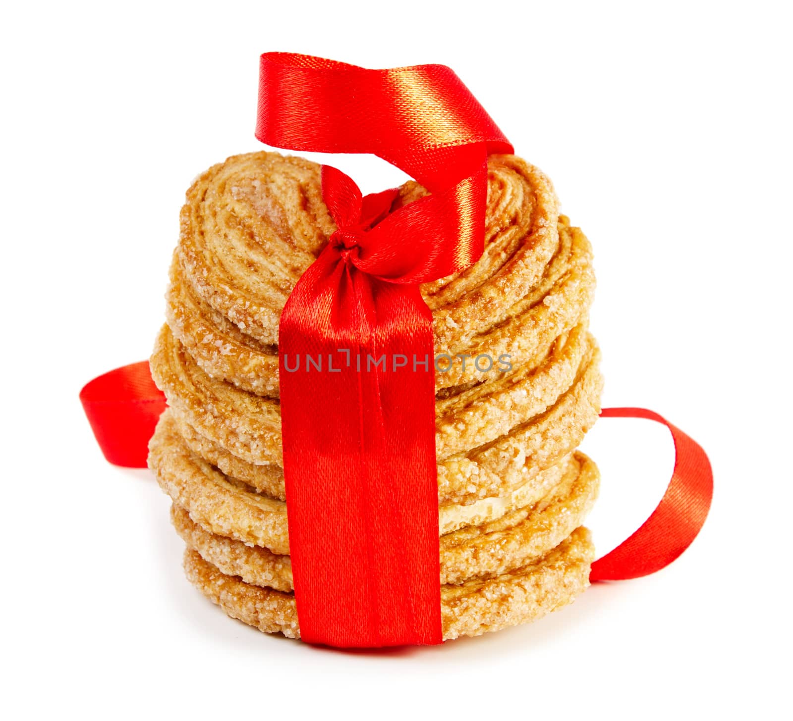 Cookies with red ribbon isolated on white background