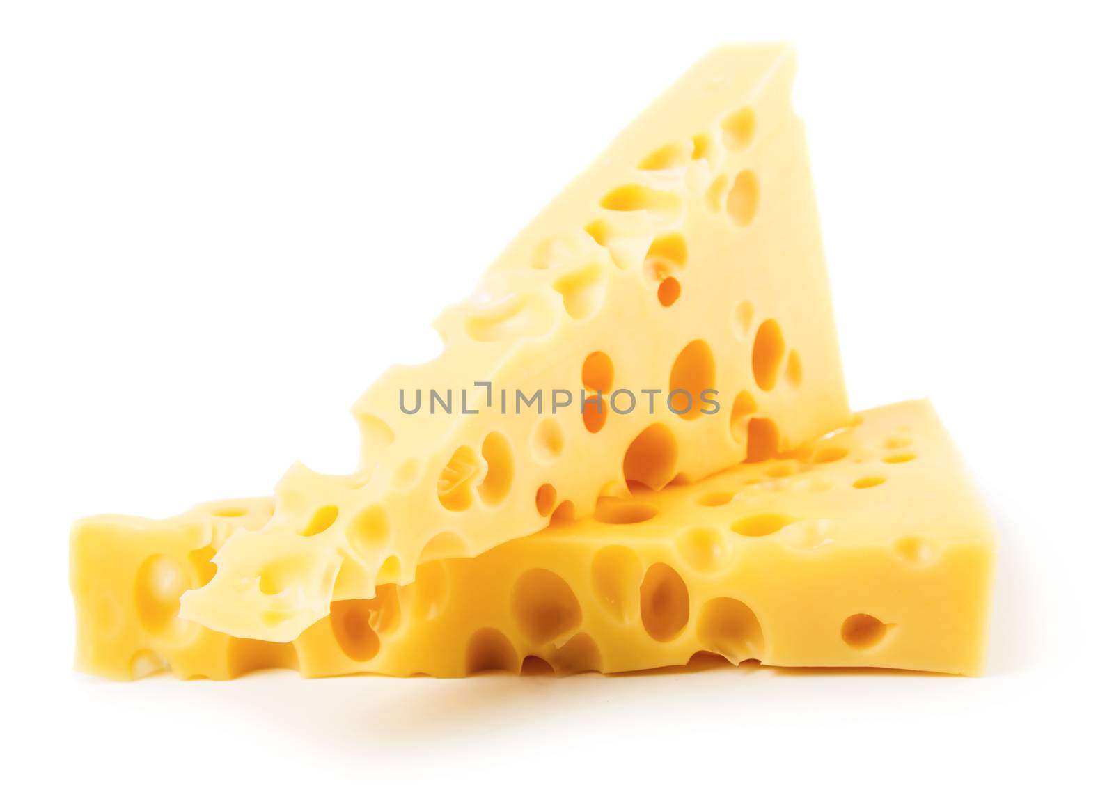 Pieces of cheese isolated on white background