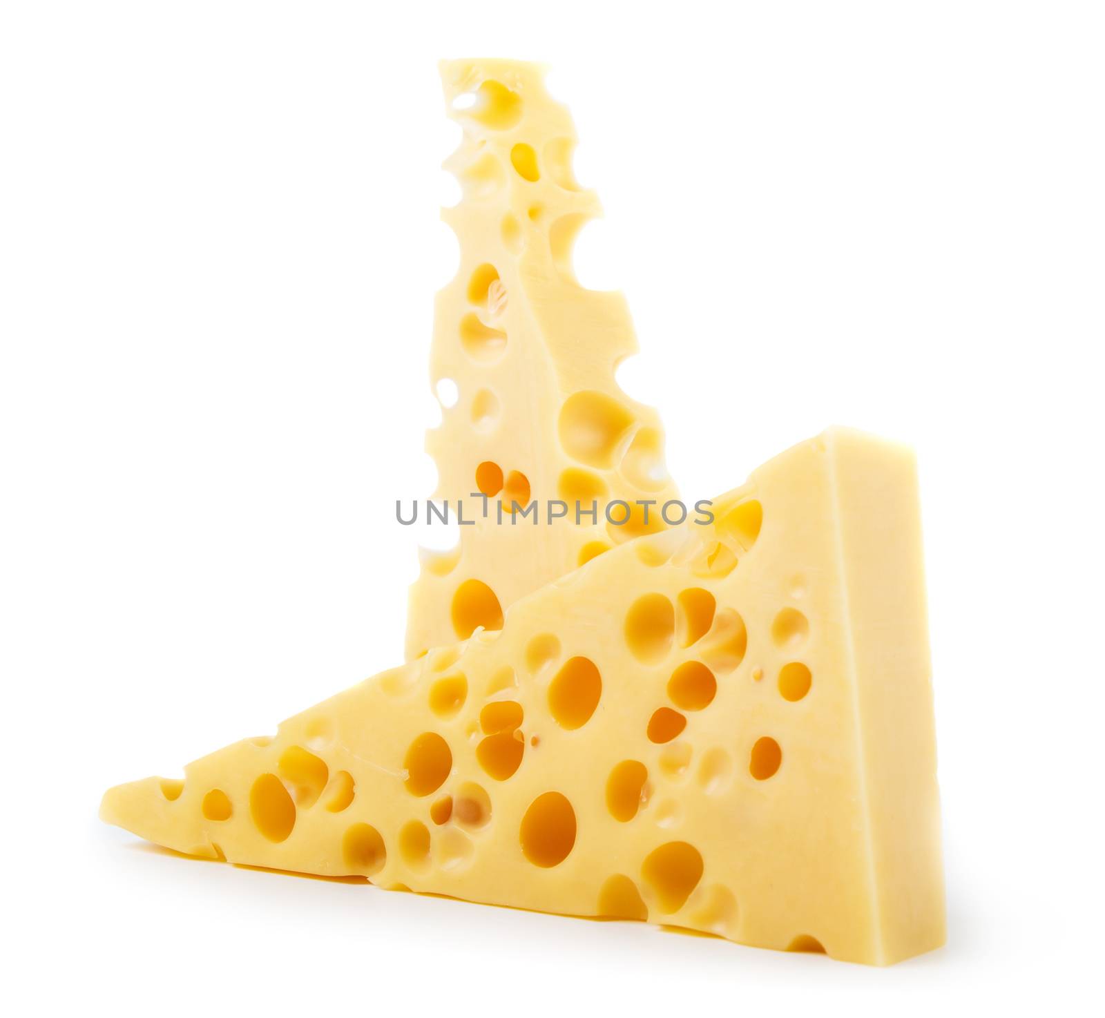 Pieces of cheese isolated on white background