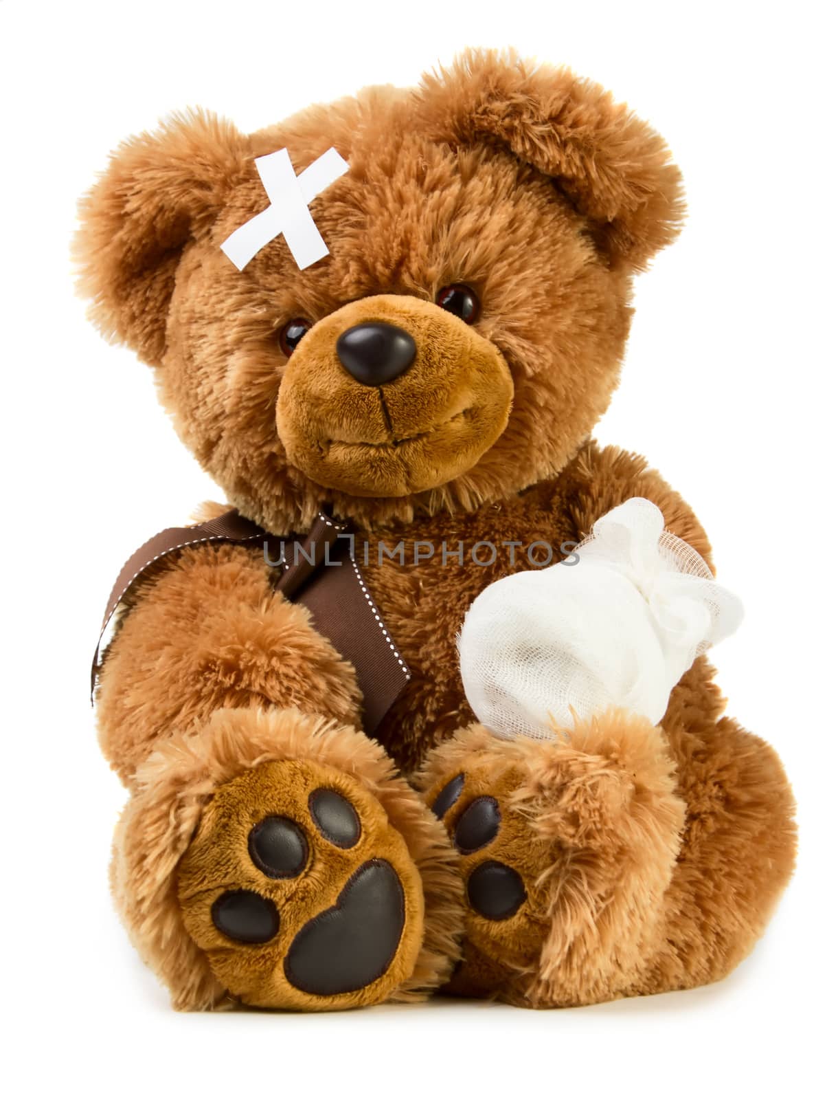 Teddy bear with bandage isolated on white background