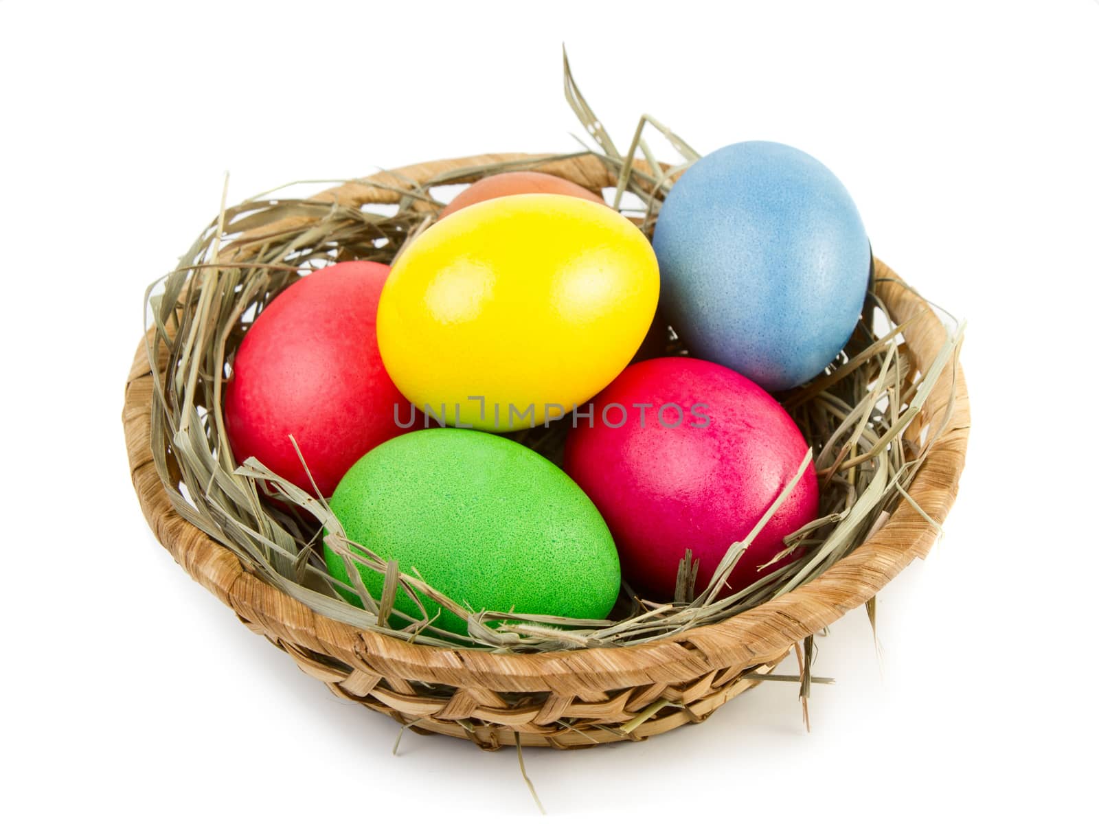 Easter eggs in nest isolated on white background
