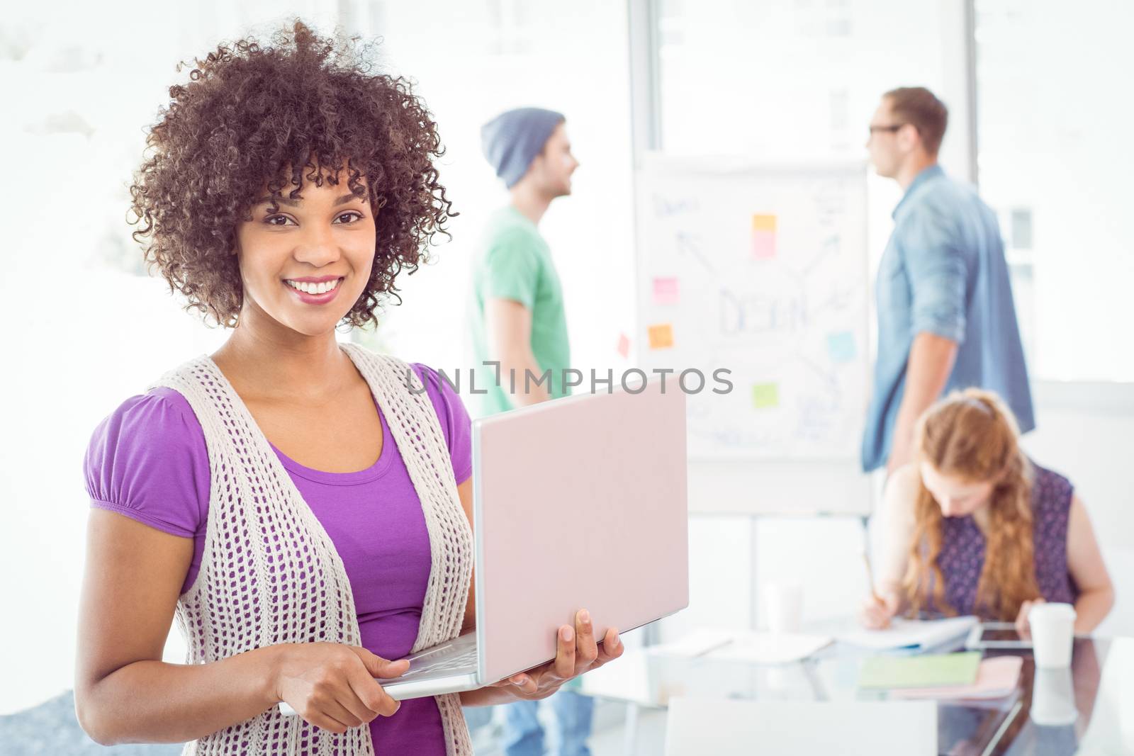 Fashion students working as a team  by Wavebreakmedia