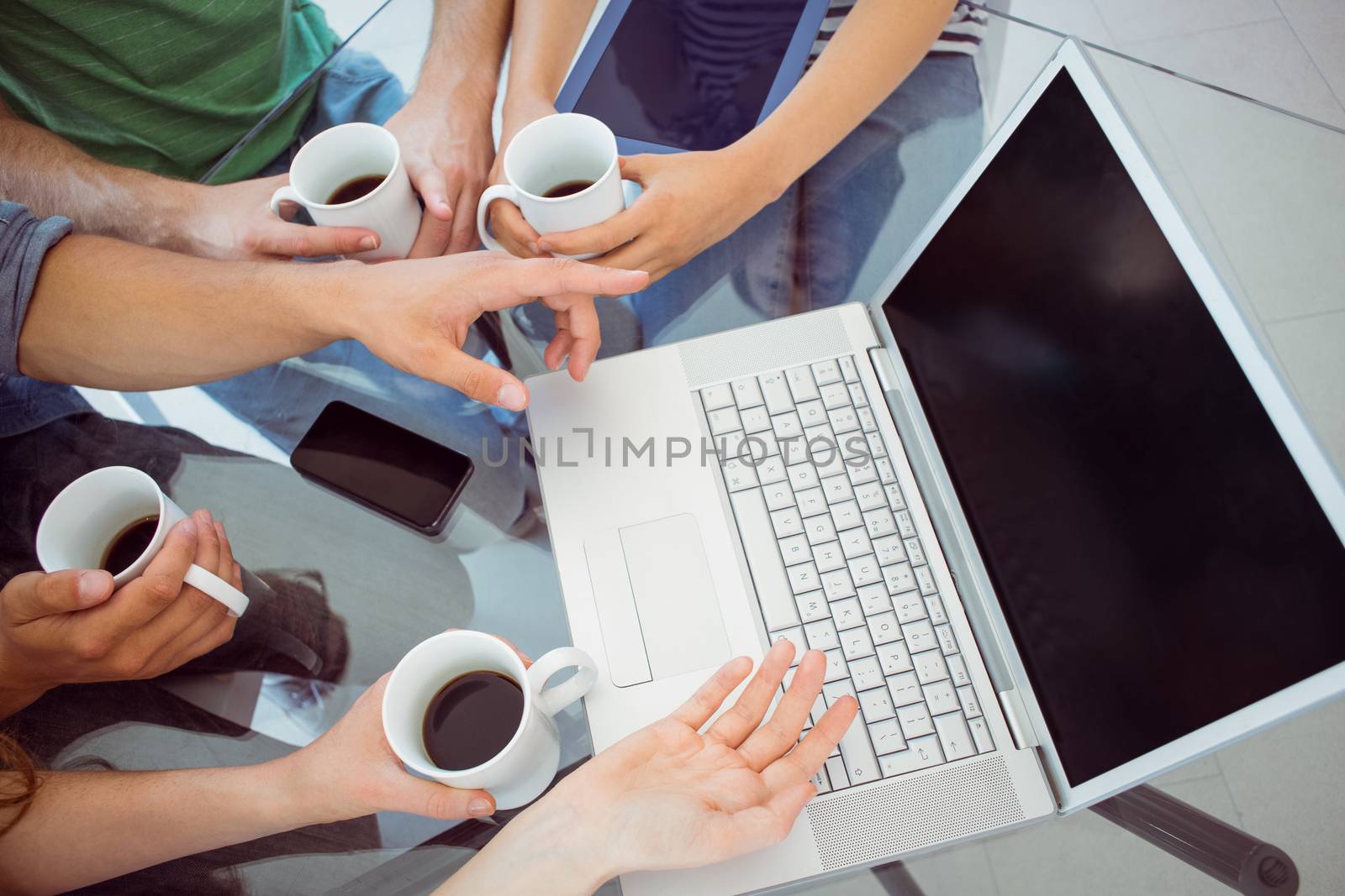 Fashion students holding cup of coffee  by Wavebreakmedia