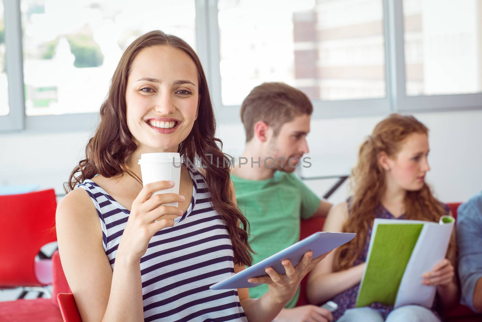 Fashion student smiling at camera at the college