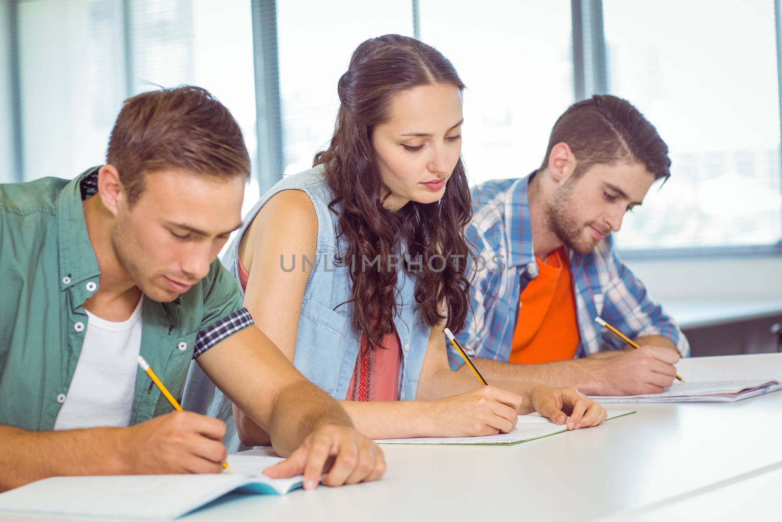 Fashion students taking notes in class at the college