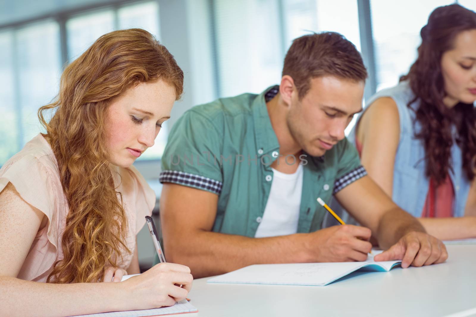 Fashion students taking notes in class at the college