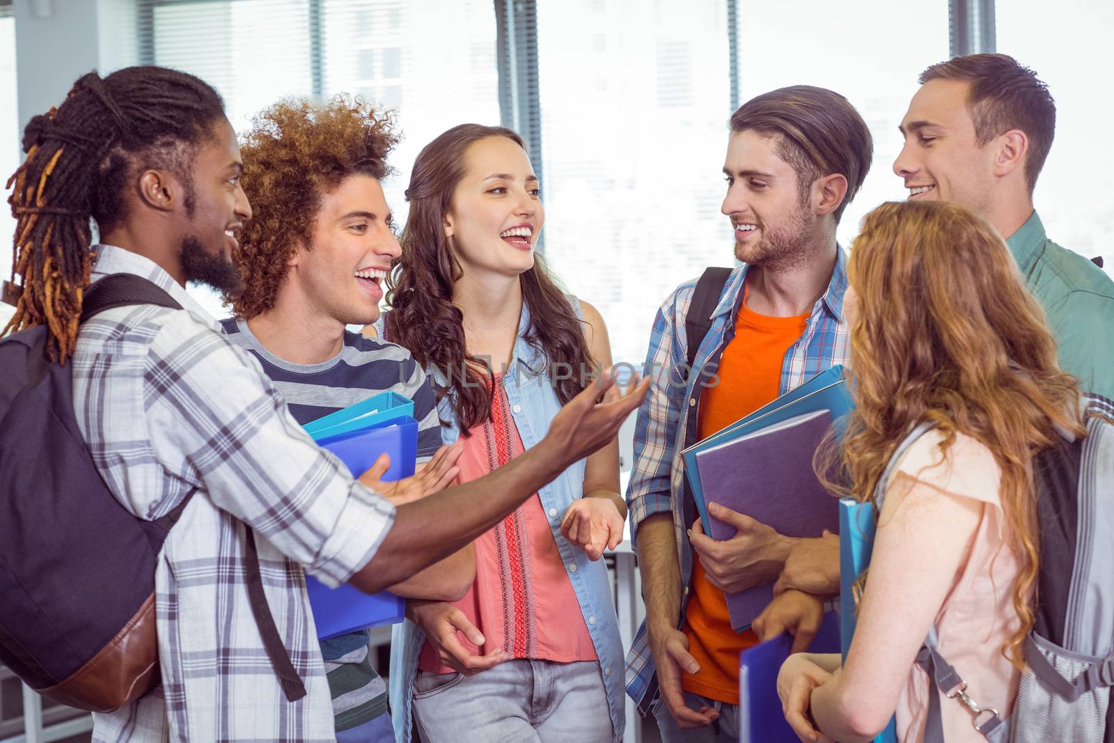 Fashion students chatting and smiling at the college