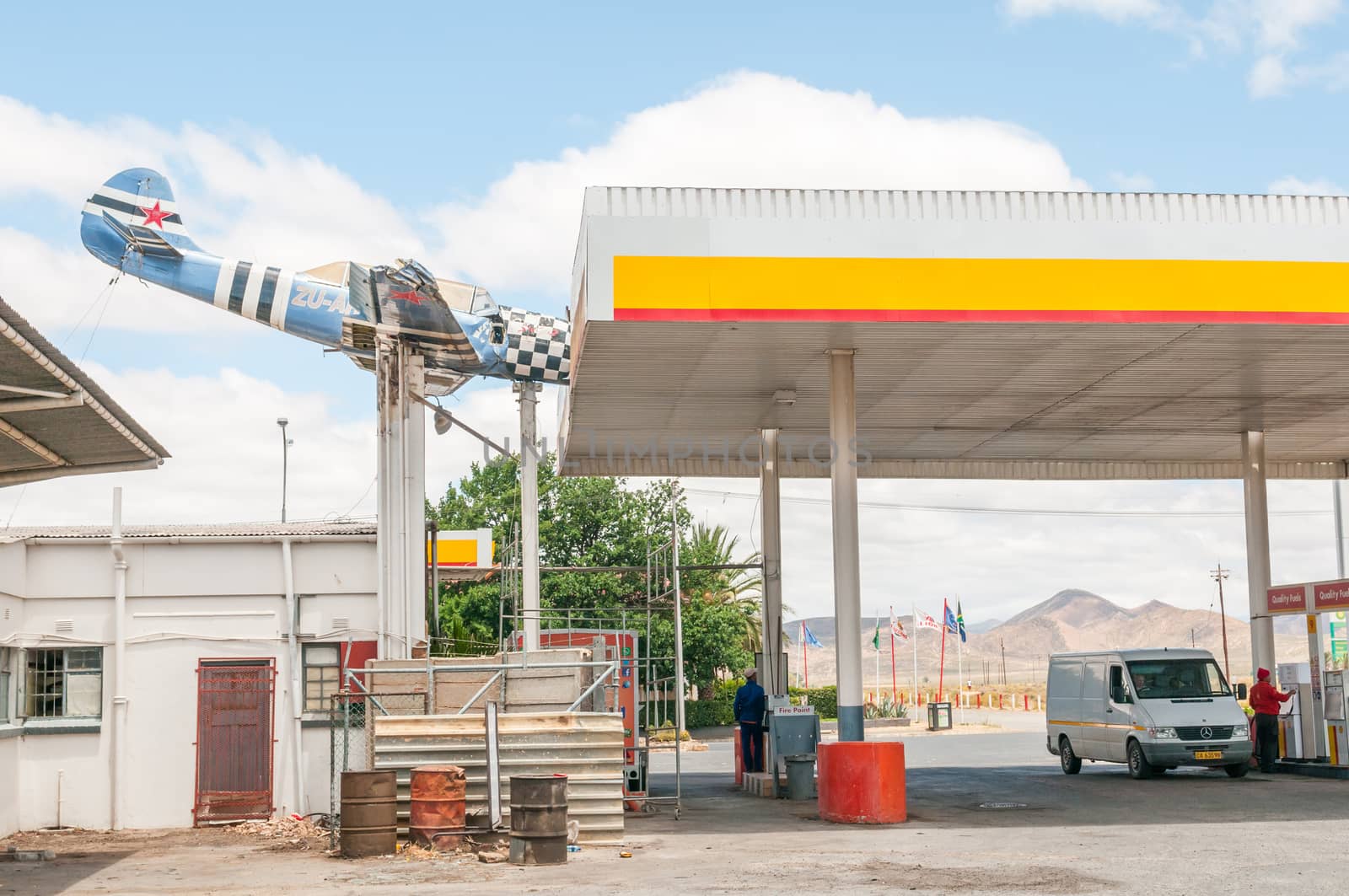 TOUWS RIVER, SOUTH AFRICA - DECEMBER 2, 2014: An aeroplane wreck mounted in such a way as if it hit the roof at a local gas station