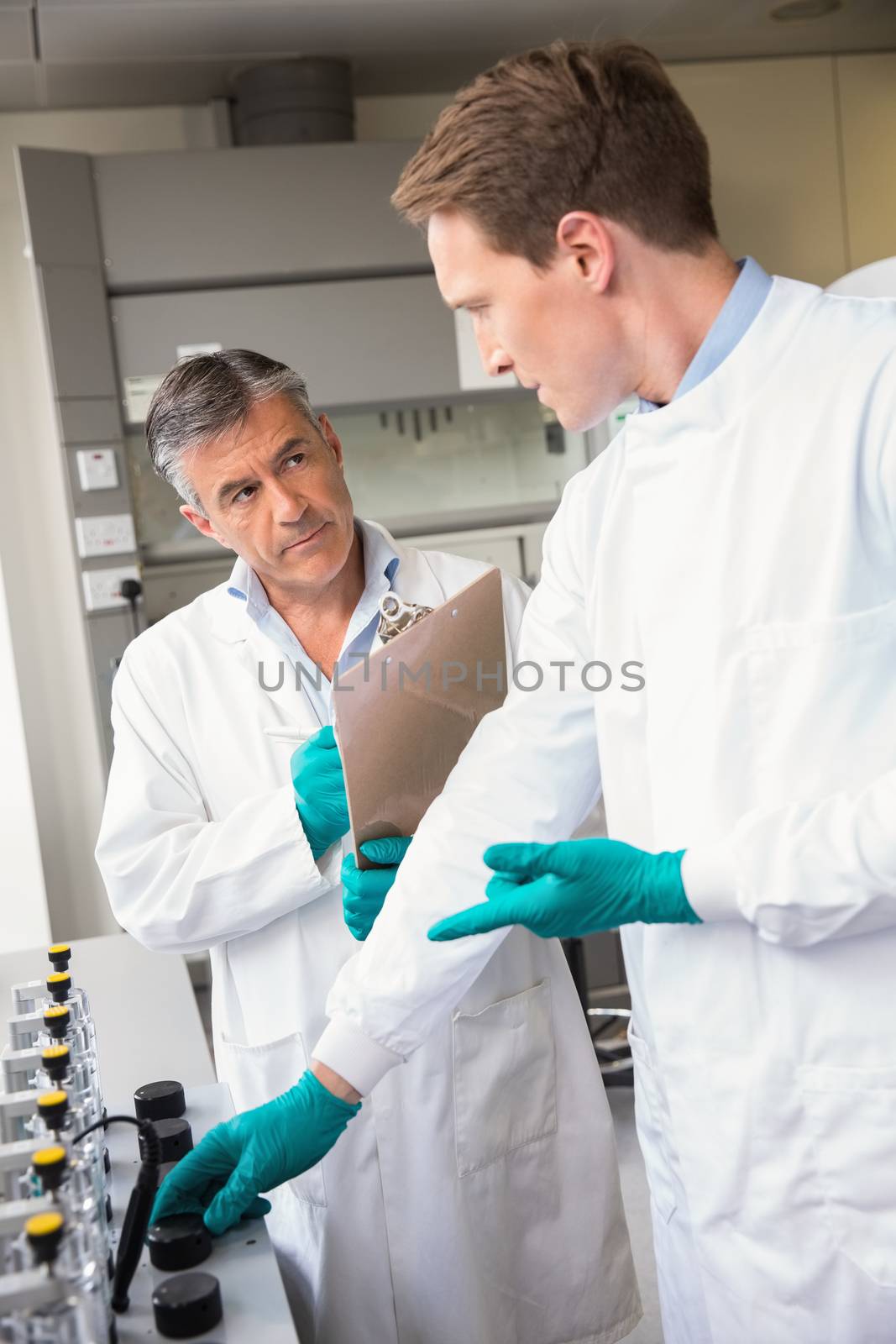Team of scientists working together  by Wavebreakmedia
