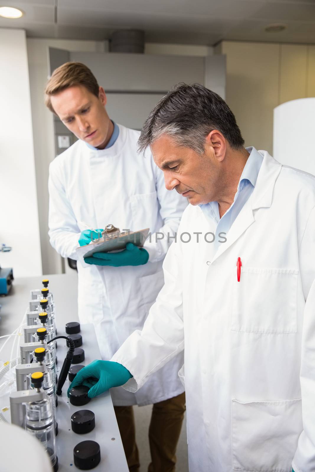 Team of scientists working together  at the laboratory