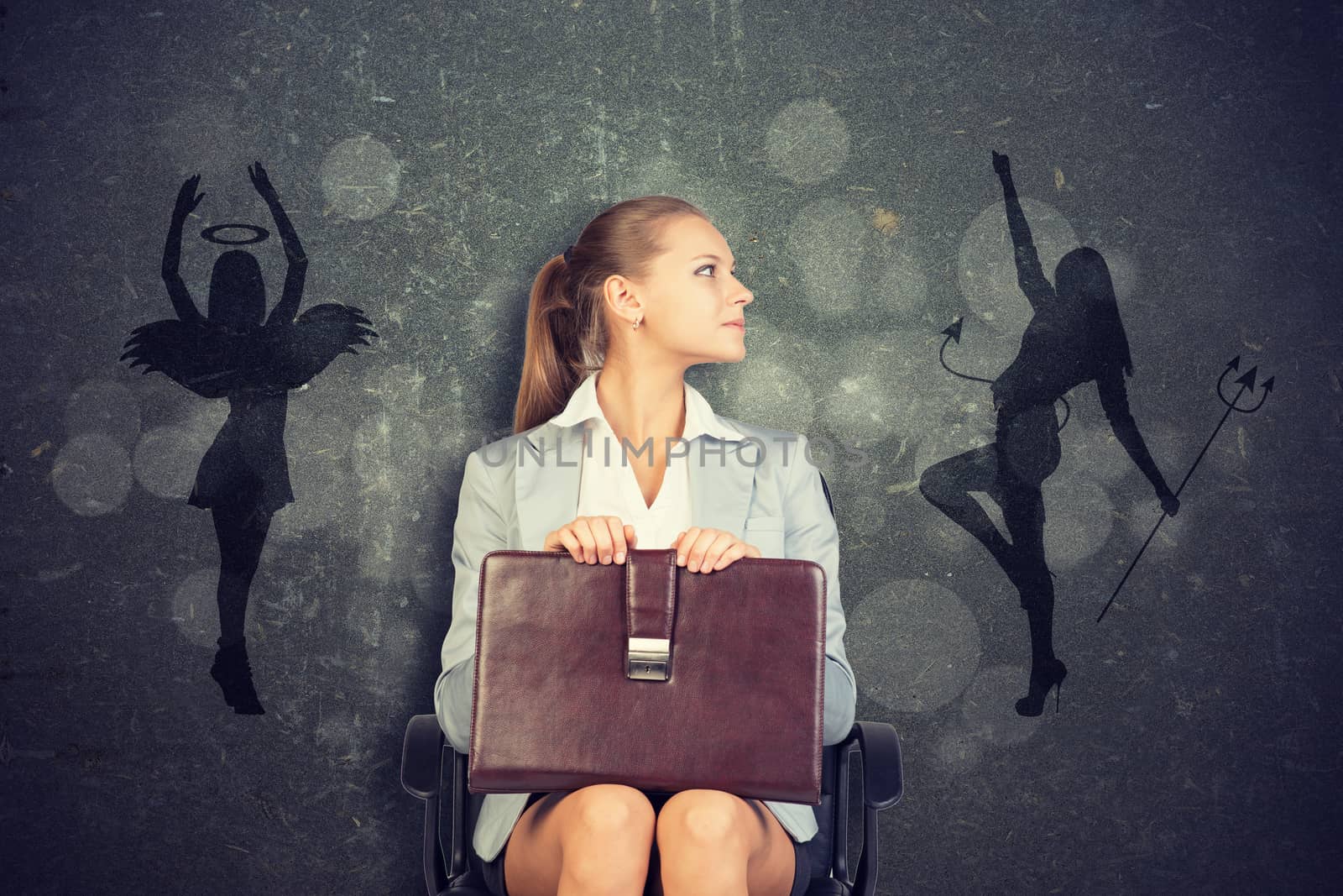 Young Businesswoman Sitting in Chair with Briefcase in Lap Looking to the Side, Framed by Silhouettes of Angel and Devil in Ethical Concept Image