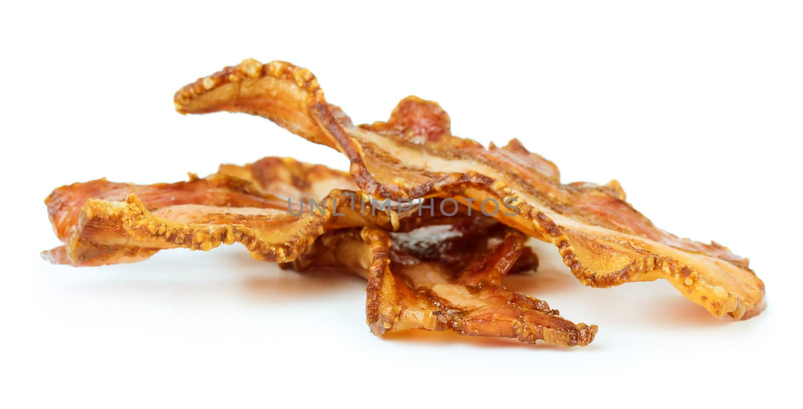 Three cooked bacon slices isolated on white background