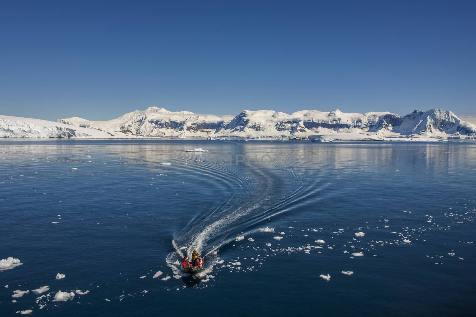 Adventure Tourists in Cuverville Bay on the Antarctic Peninsula in Antarctica. 