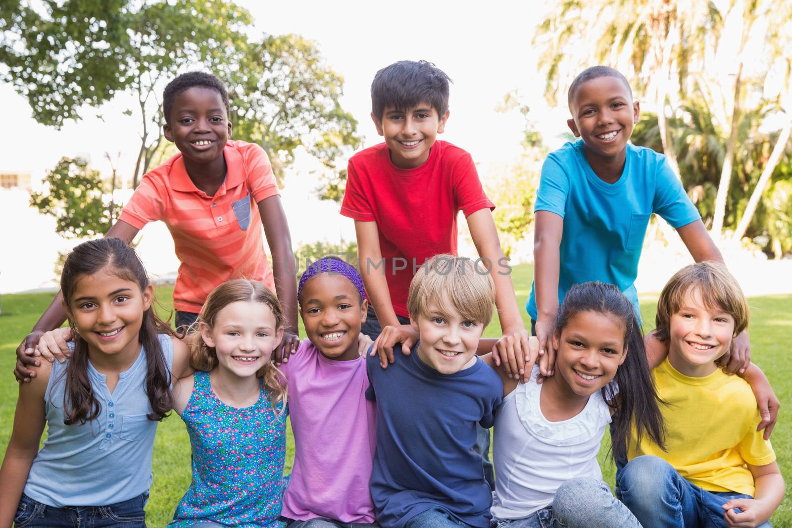 Happy friends in the park on a sunny day 