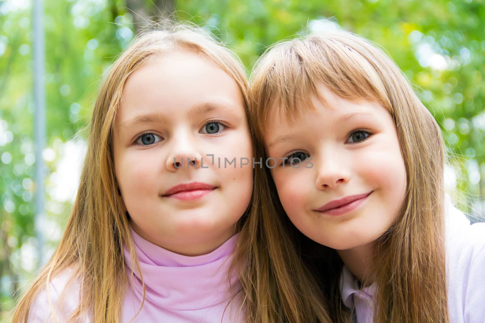 Photo of two cute girls with long hairs