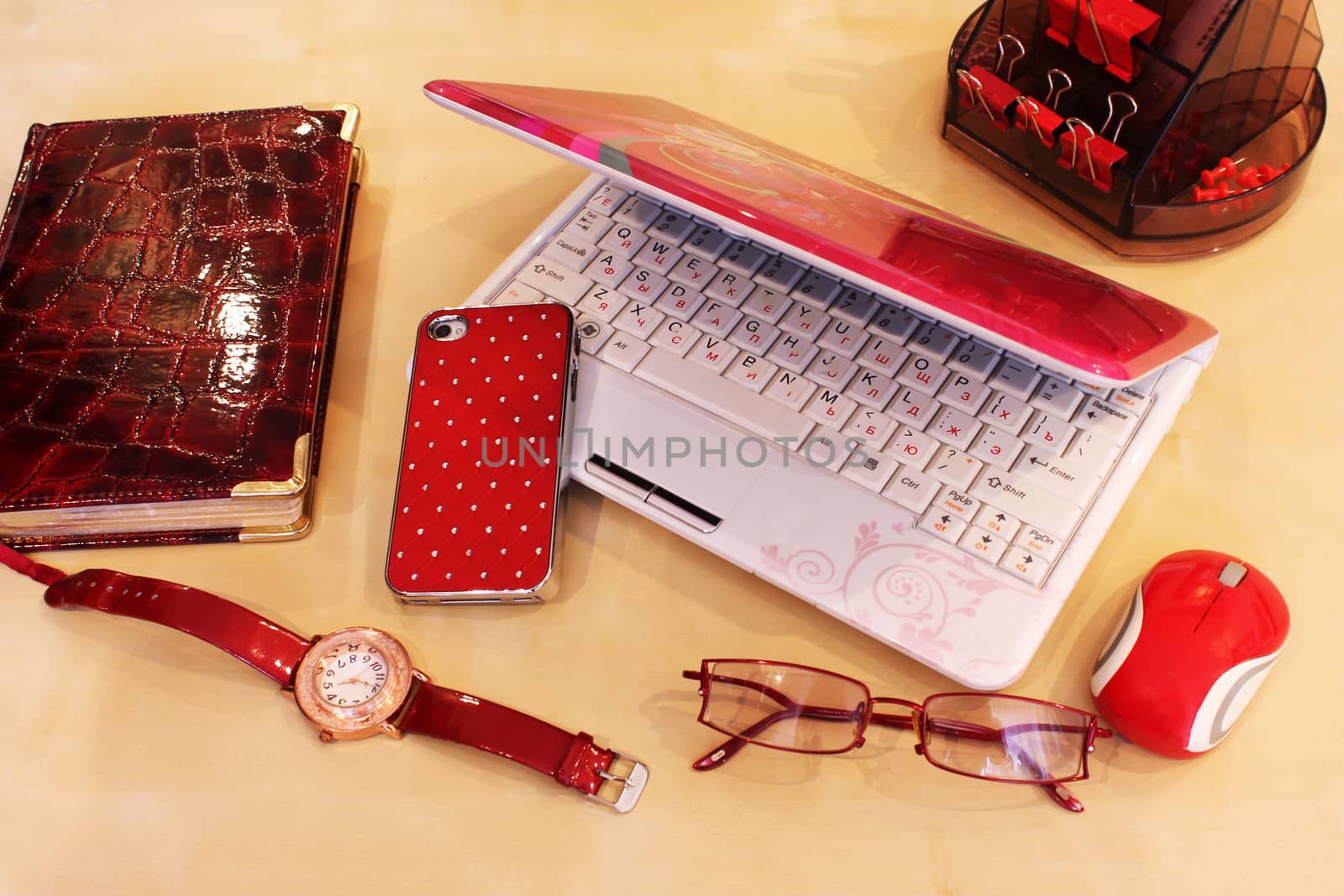 Stationery and business accessories in red color scheme