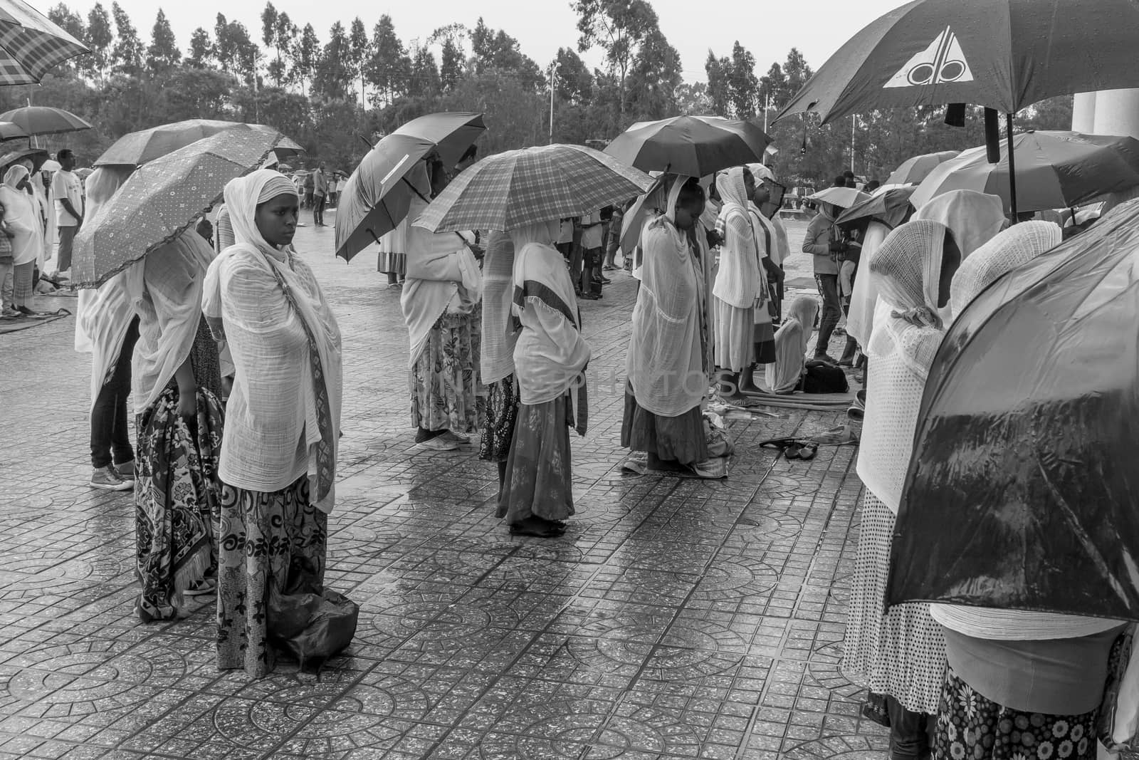 Addis Ababa: April 10: Devoted Ethiopian Orthodox followers stand undeterred by the pouring rain to observe Siklet, the crucifixion of Jesus Christ, at Bole Medhane Alem Church on April 10 ,2015 in Addis Ababa, Ethiopia