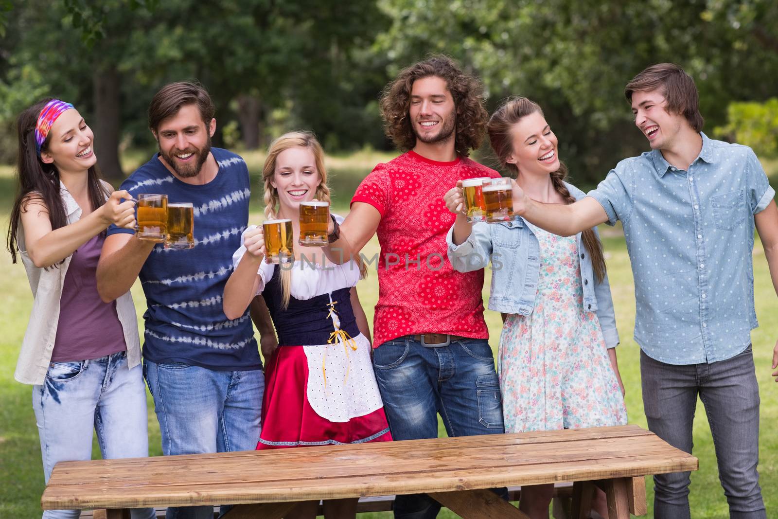 Group of friends celebrating oktoberfest on a sunny day