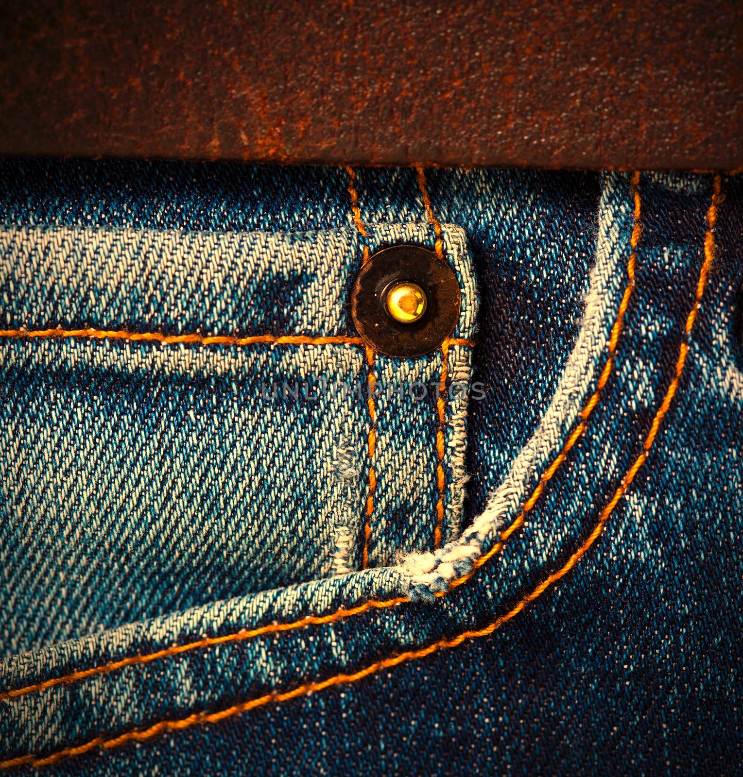 part of jeans with a brown leather belt, close up. instagram image style