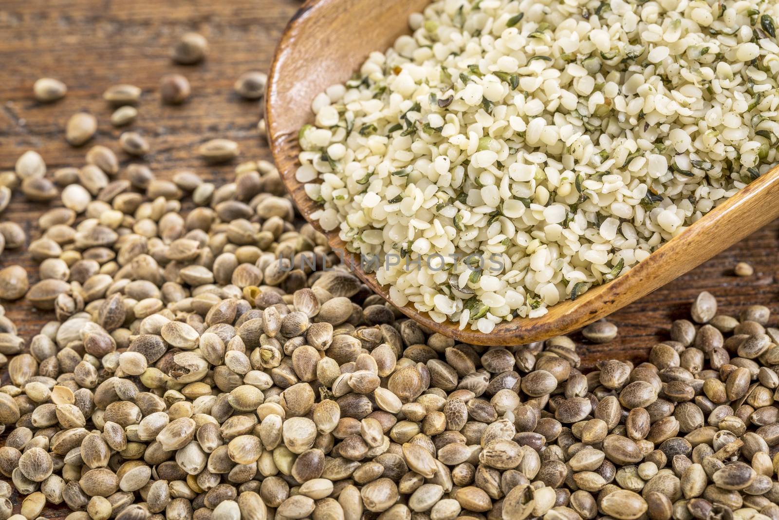 hemp seeds and hearts in a rustic wooden scoop