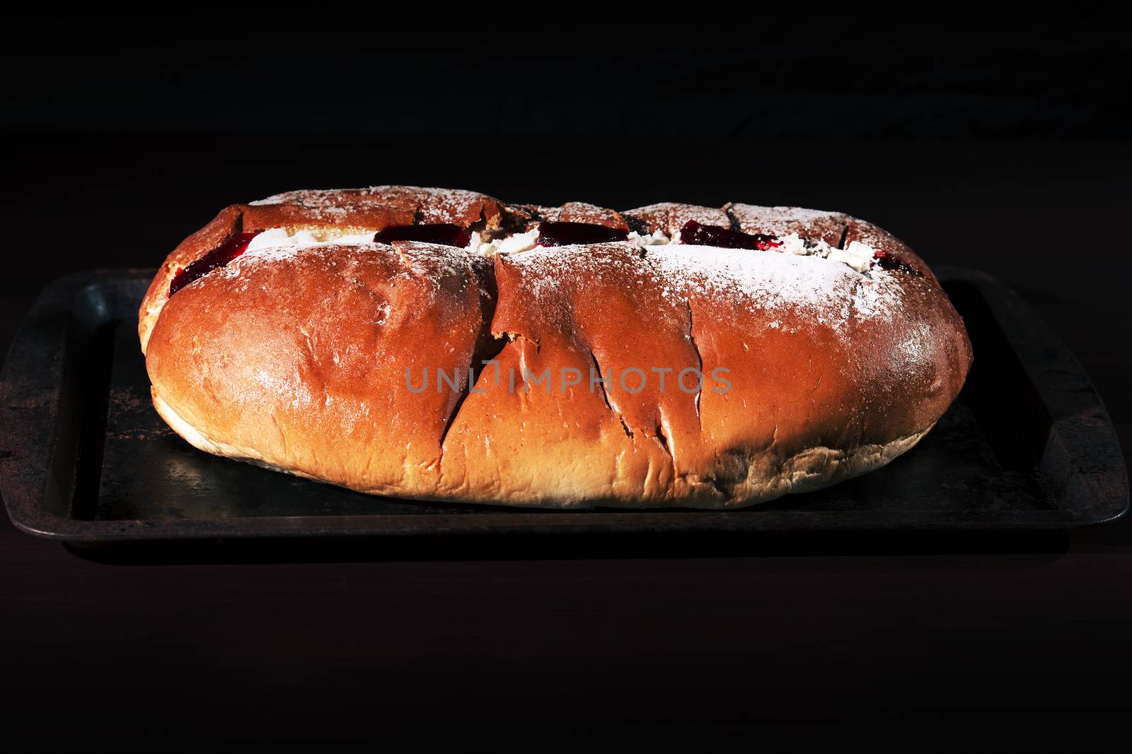 Raspberry jam and cream pastry on a baking tray