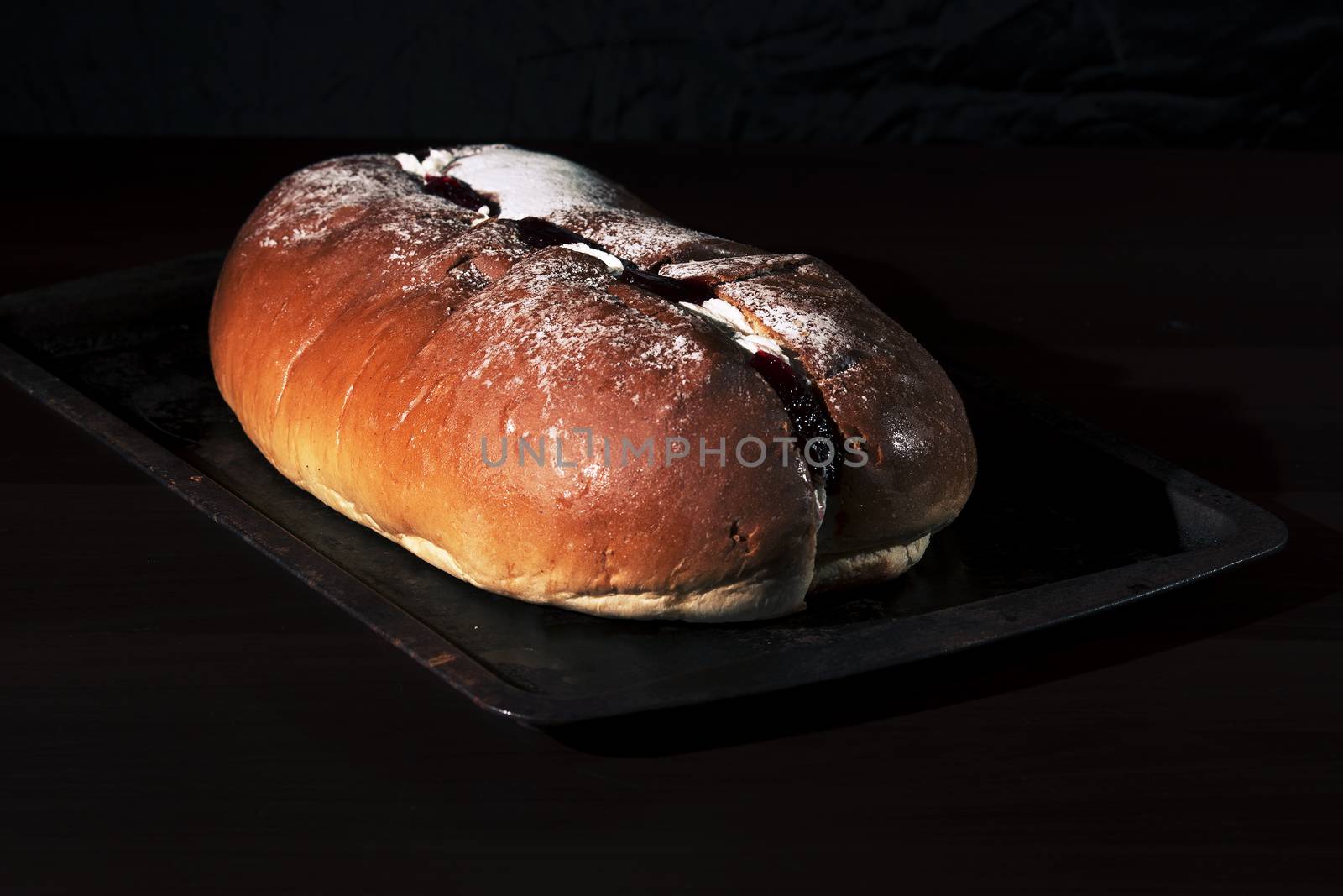 Raspberry jam and cream pastry on a baking tray