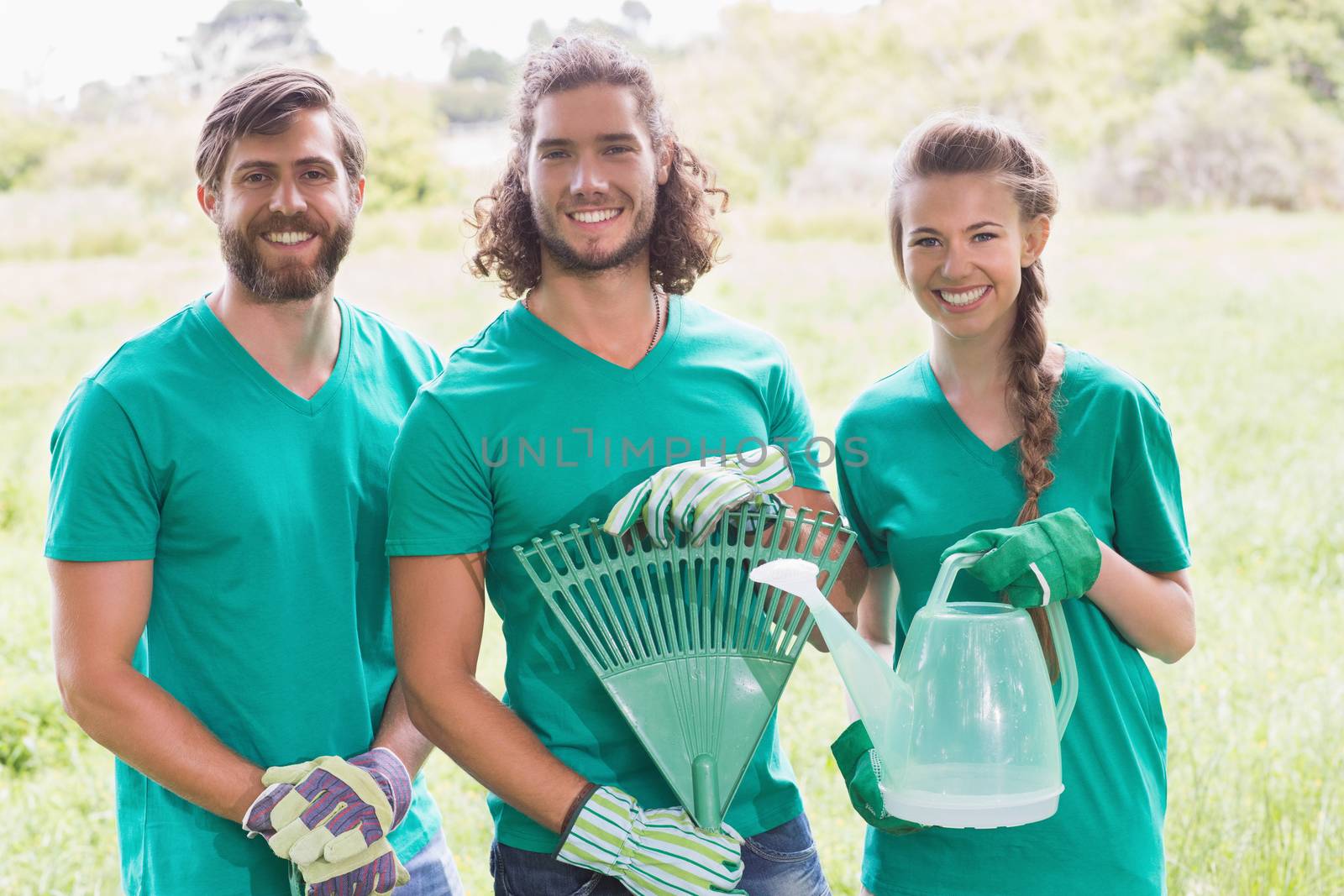 Happy friends gardening for the community by Wavebreakmedia