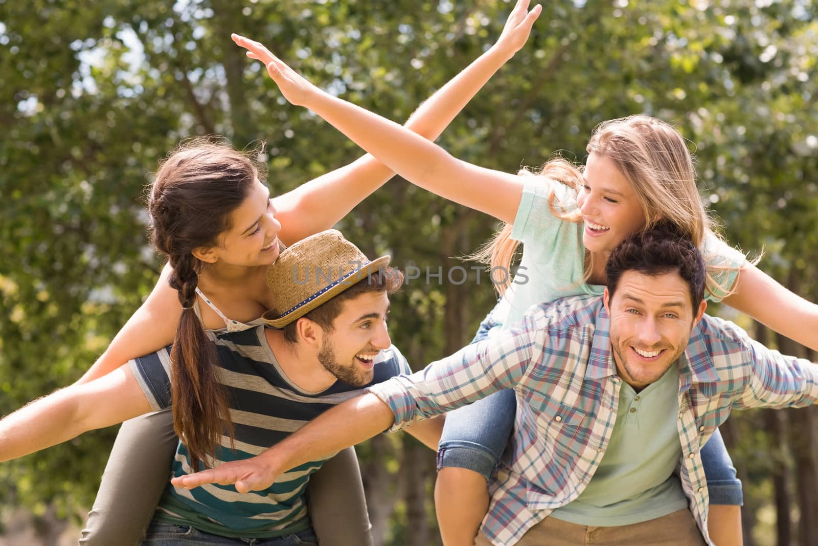 Happy friends in the park on a sunny day