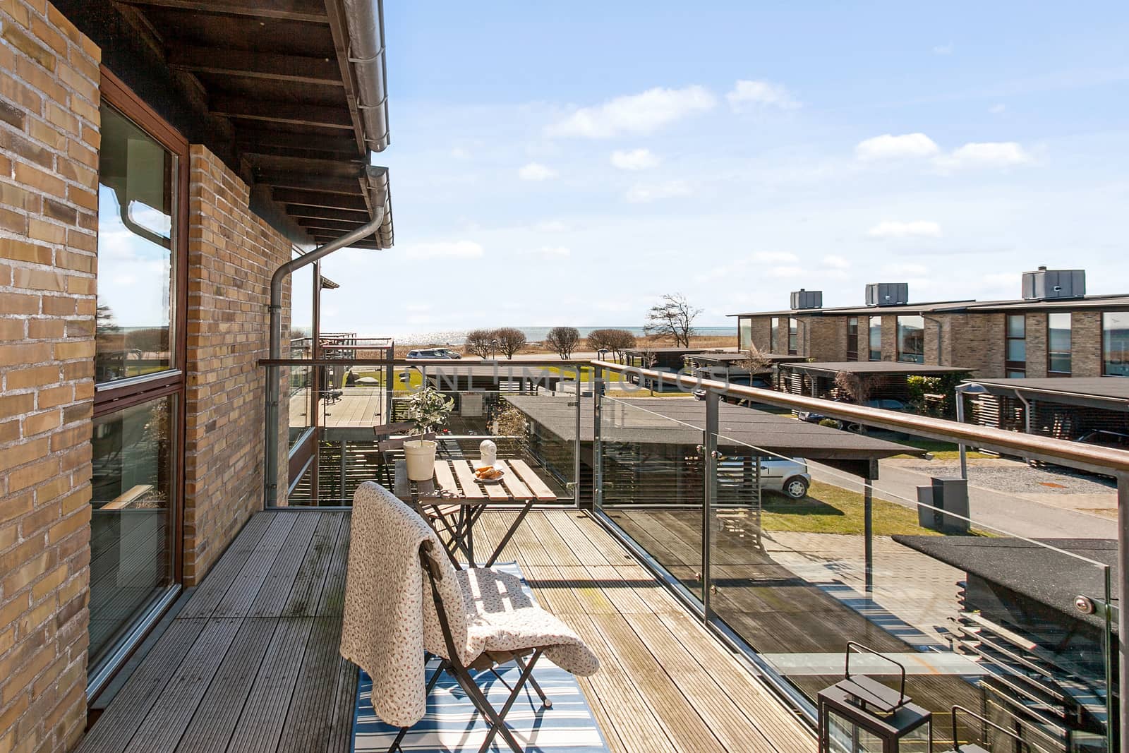 Bright balcony with furniture in a modern danish home