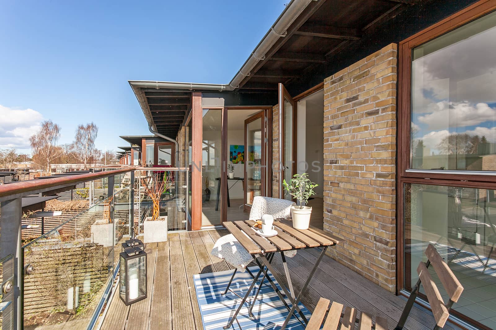 Bright balcony with furniture in a modern danish home