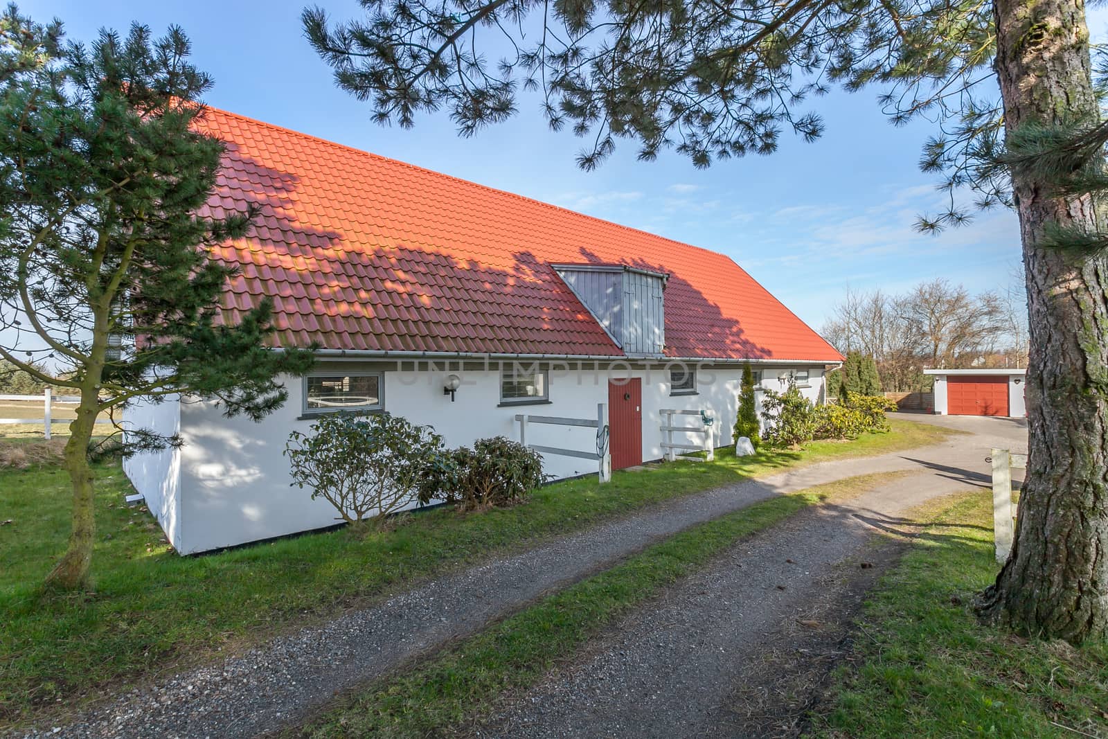 Traditional danish horse stable in the sunshine