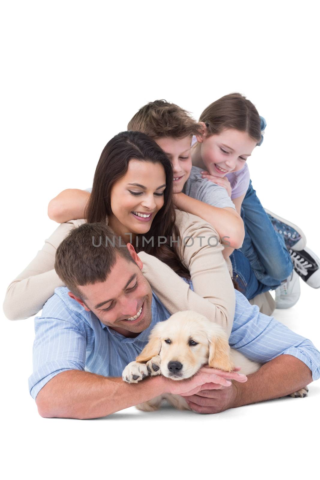 Happy family with puppy by Wavebreakmedia