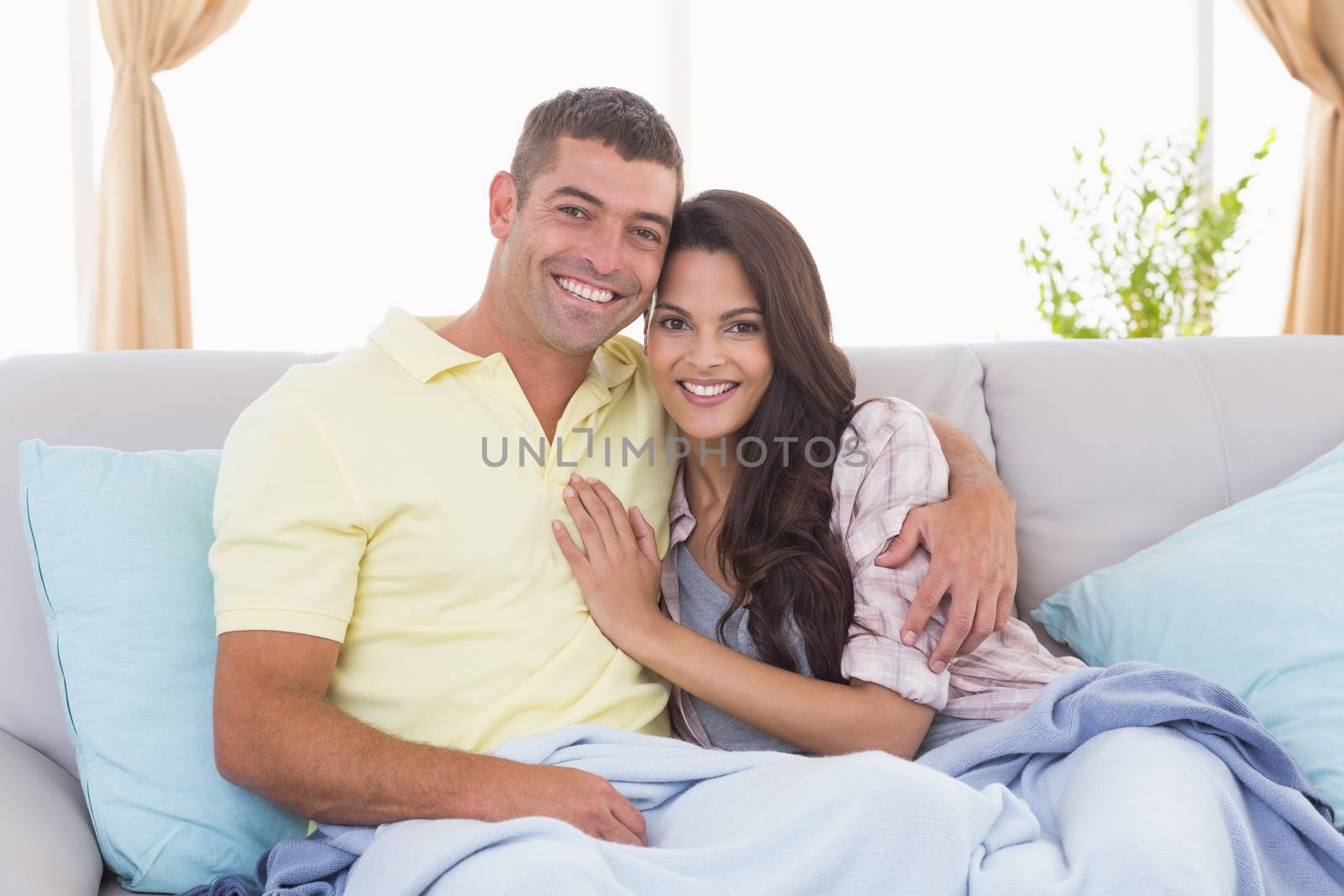 Romantic couple embracing in house by Wavebreakmedia
