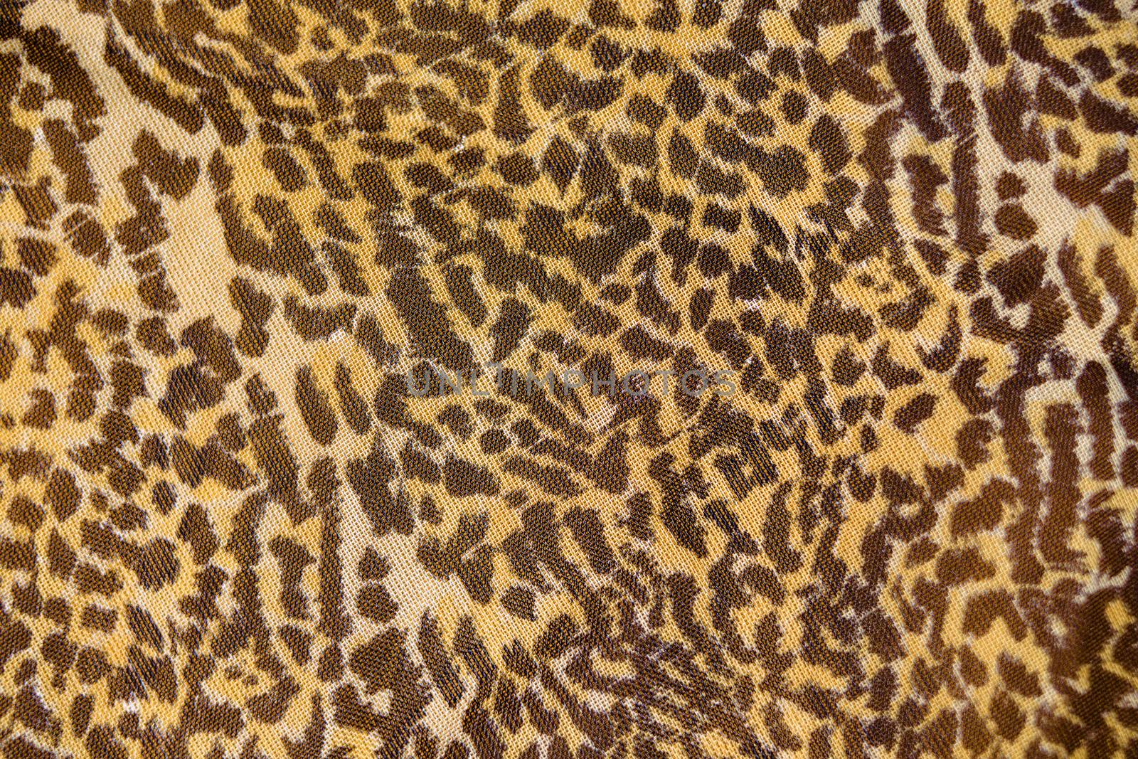 Part of the surface the nylon scarf with animal pattern. macro by pzRomashka