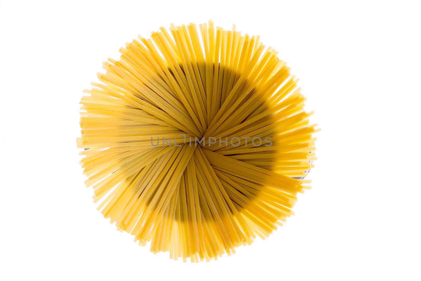 Dried fettuccine arranged in a flower effect by coskun