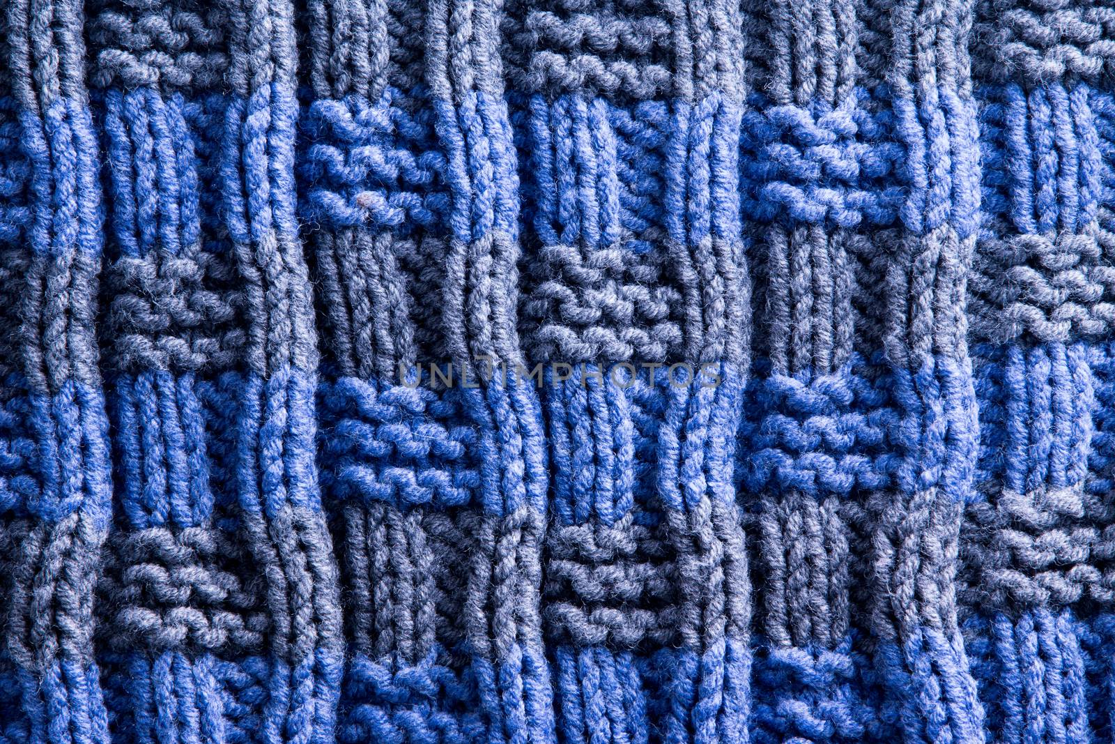 Close up Homemade Woven Crochet in Blue and Gray with Vertical Orientation of Ridge Lines. Can be Used for Wallpaper Backgrounds.