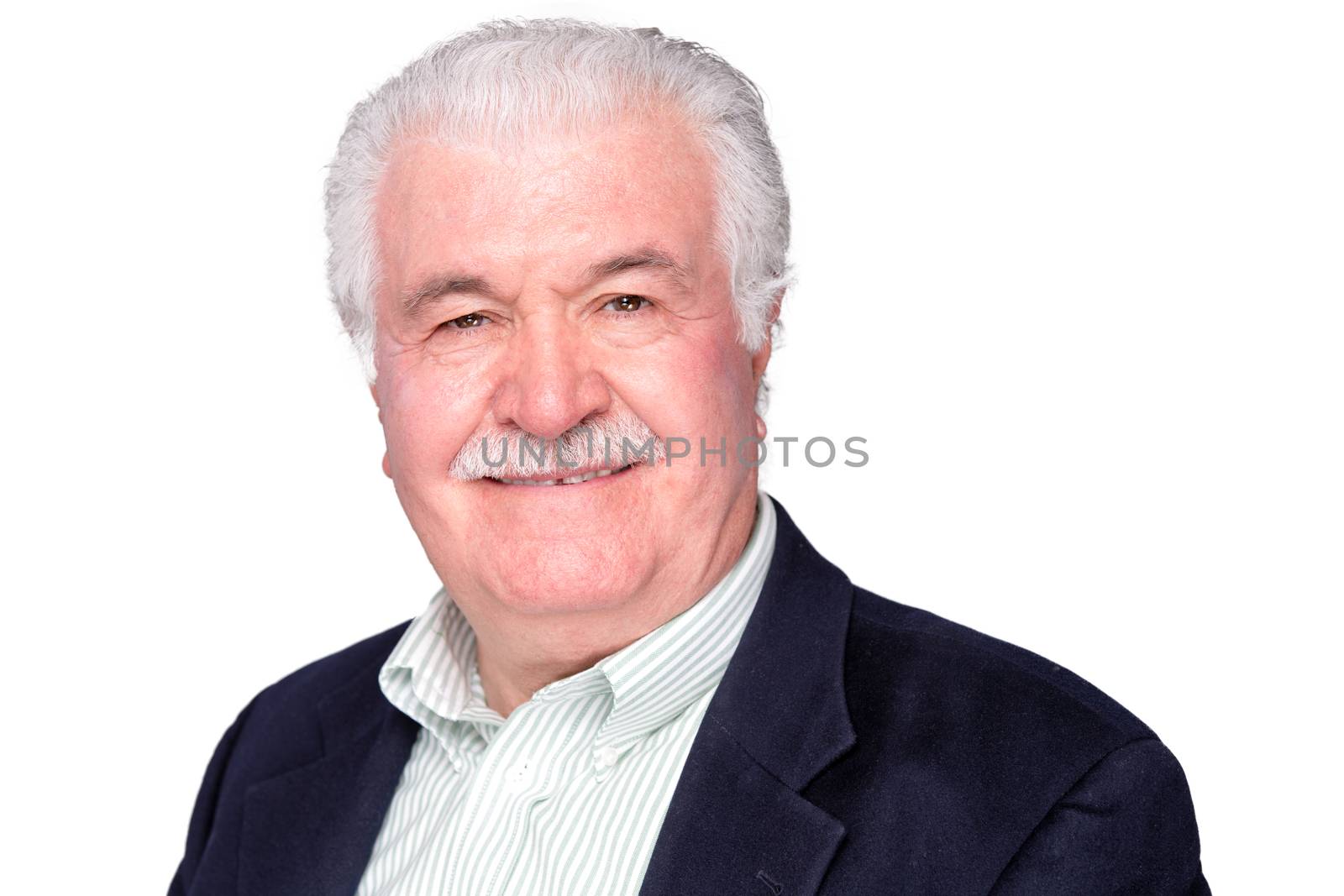 Attractive distinguished elderly gentleman with a lovely friendly smile looking at the camera, head and shoulders isolated on white