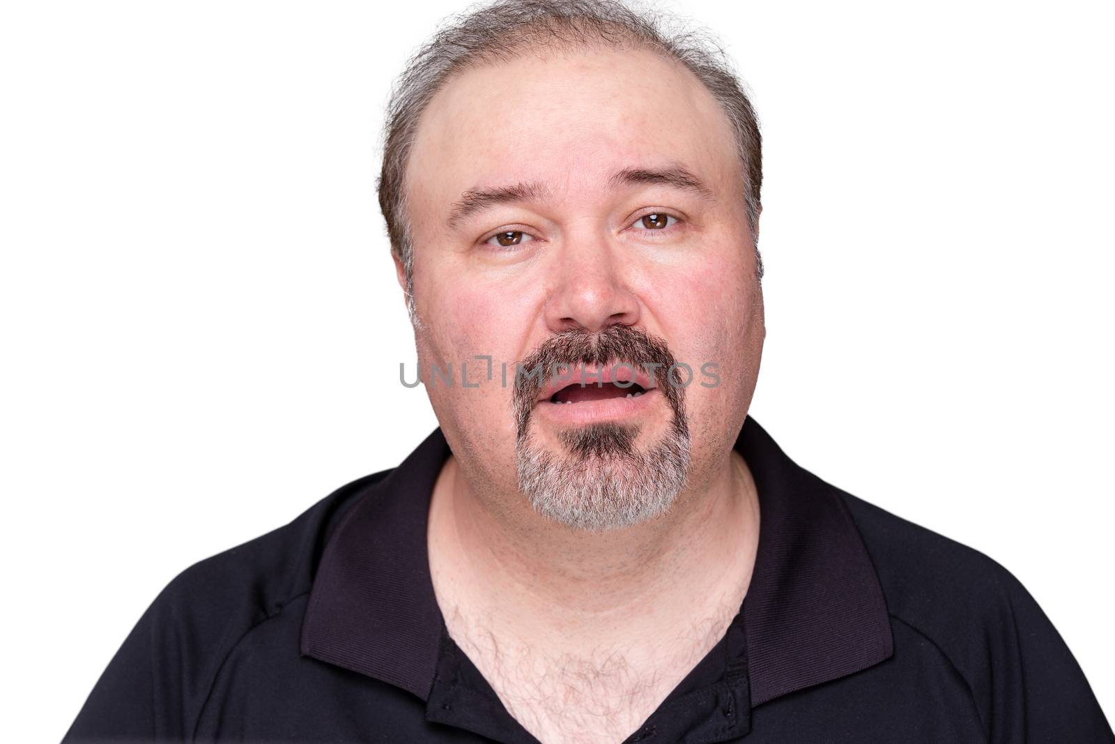 Unmotivated lethargic middle-aged man with a goatee beard looking a the camera with a dim-witted expression and his mouth ajar, isolated on white