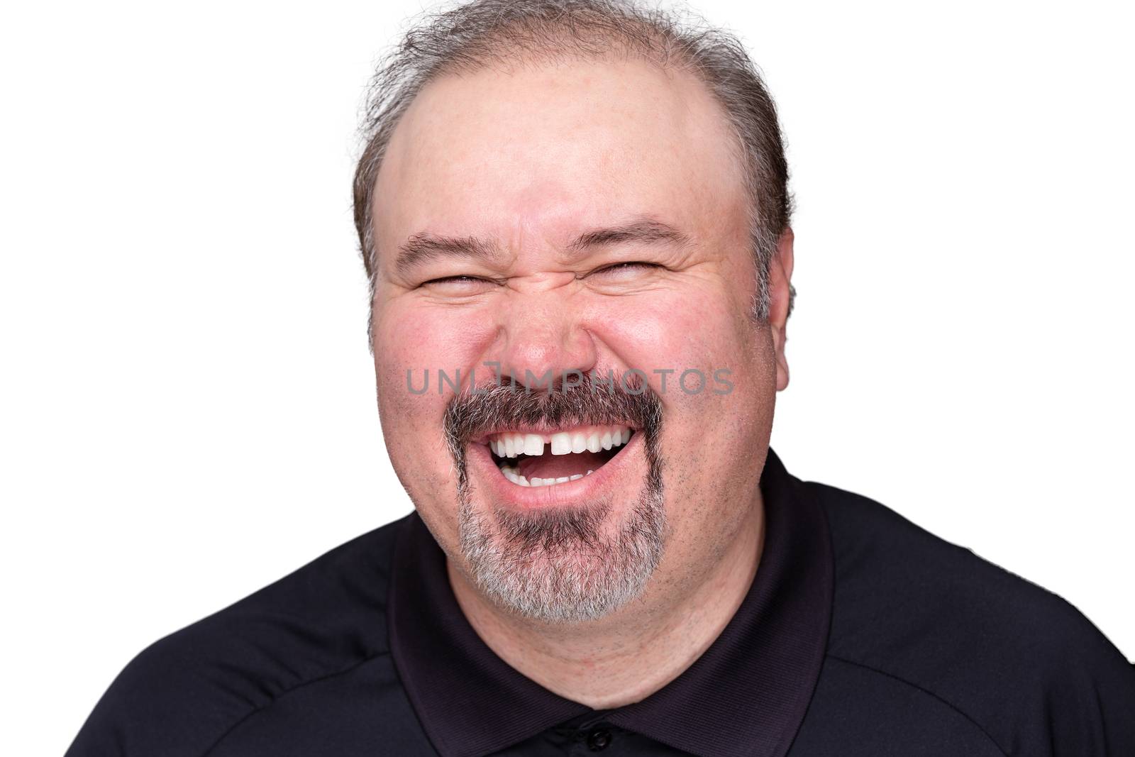 Middle-aged man with a goatee beard enjoying a good laugh , head and shoulders isolated on white