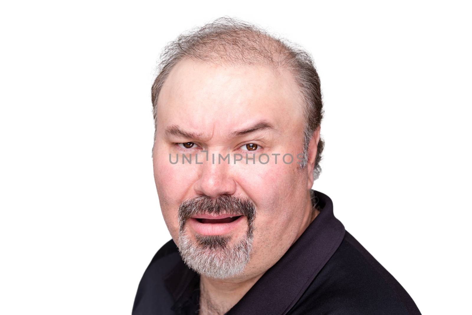 Incredulous man raising his eyebrow as he questions the veracity of something with a scoffing sneer, isolated on white