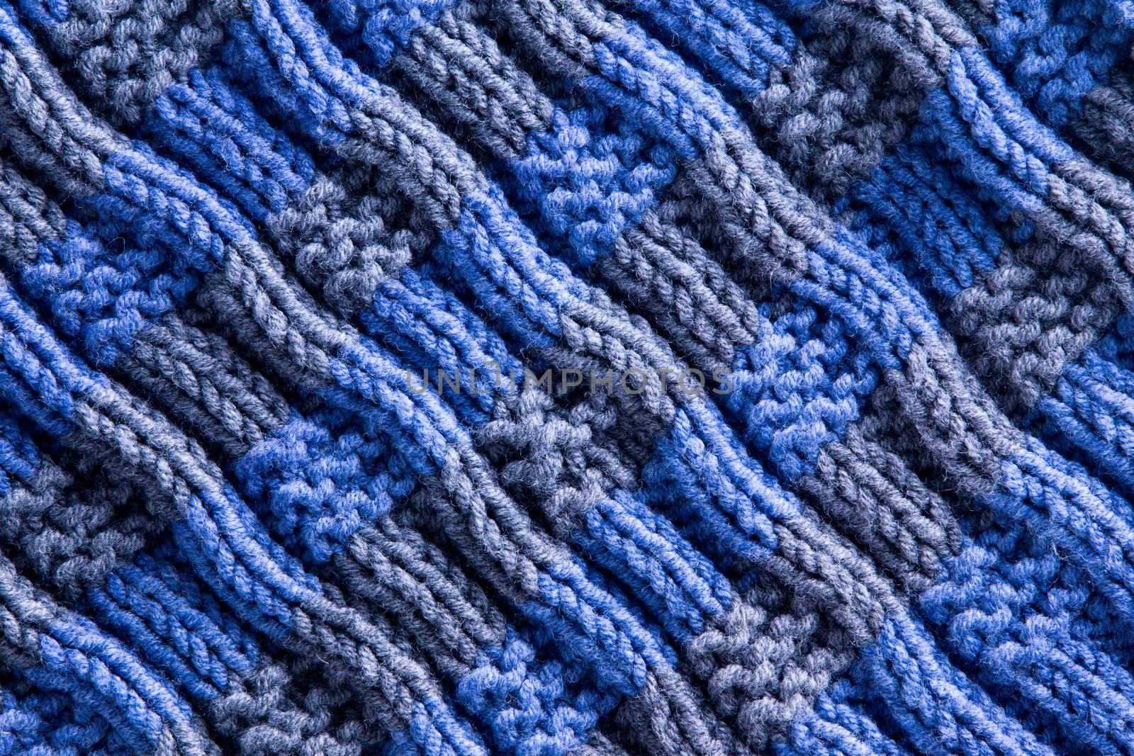 Close up Homemade Woven Crochet in Blue and Gray Colors with Diagonal Ridge Lines. Can be Used for Background Designs.