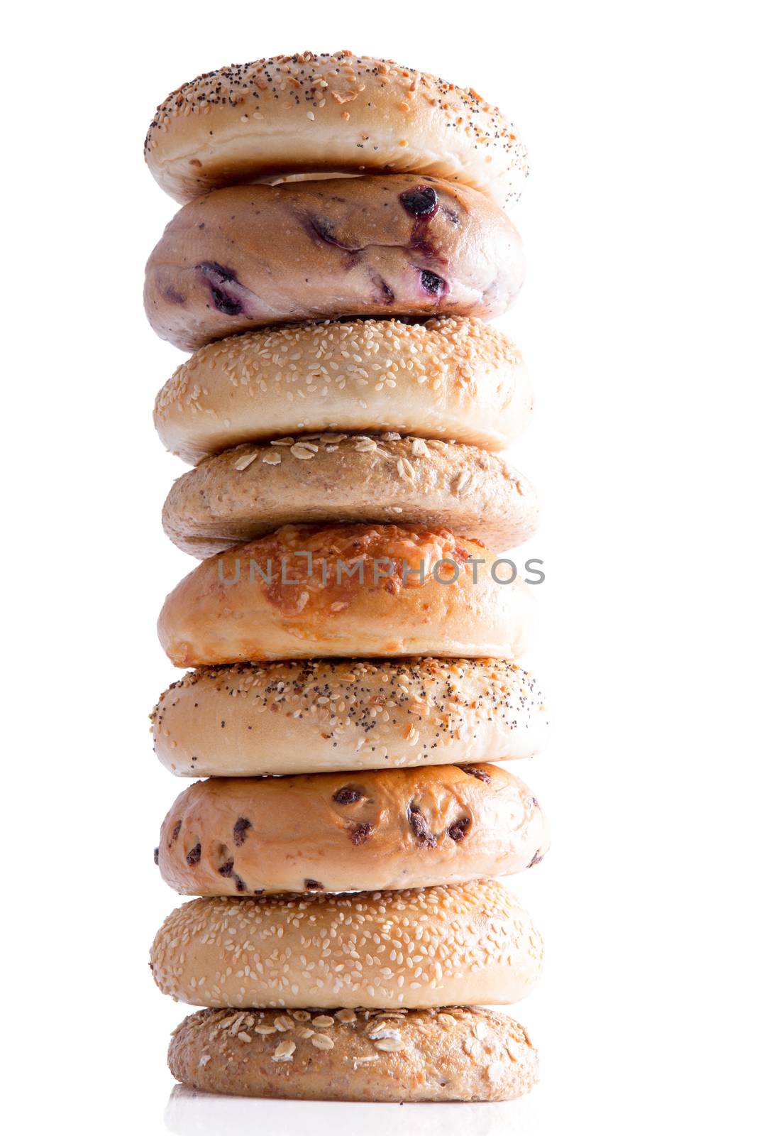 Tasty Homemade Bagel Breads Piled Vertically by coskun