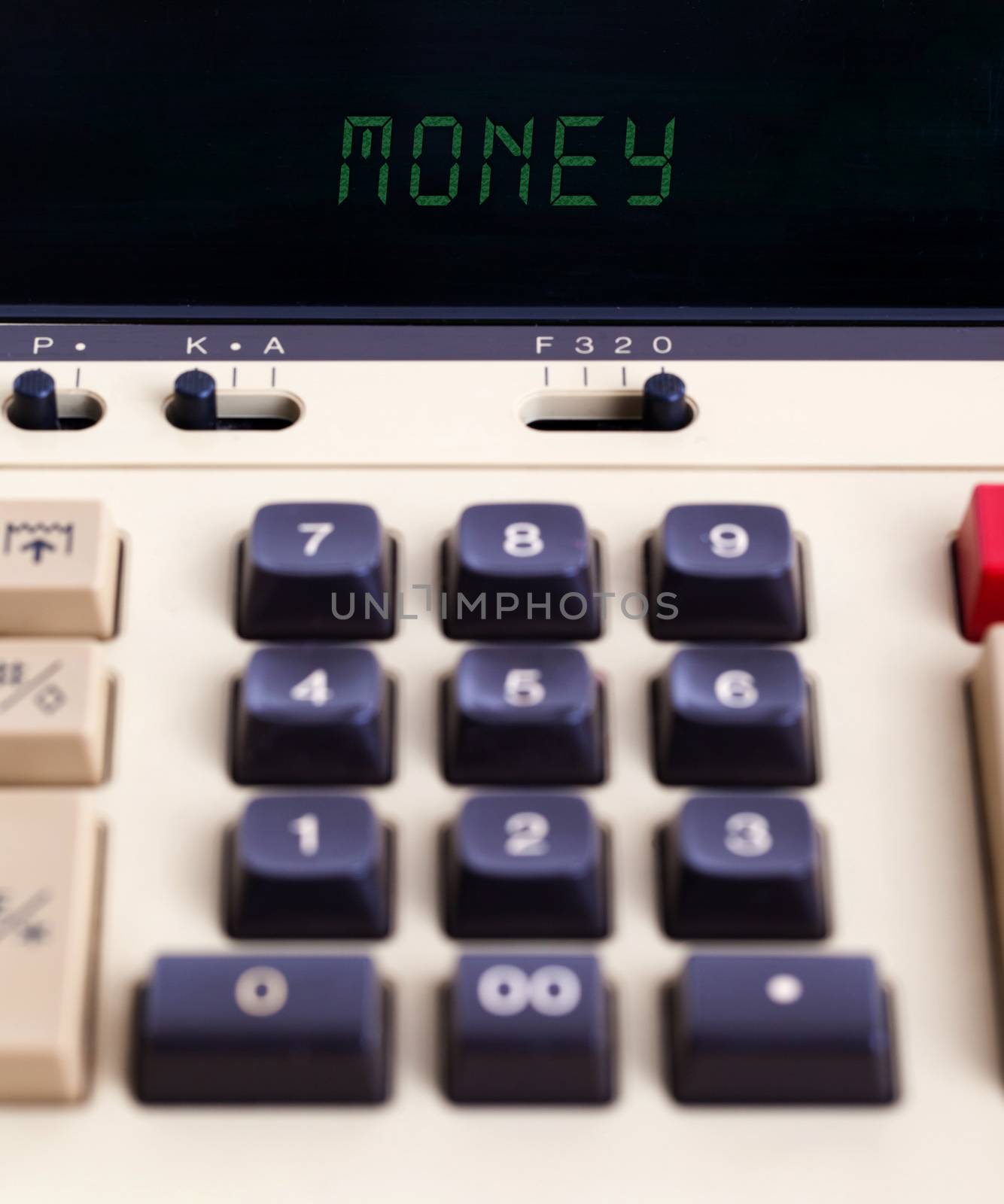 Old calculator showing a text on display - money