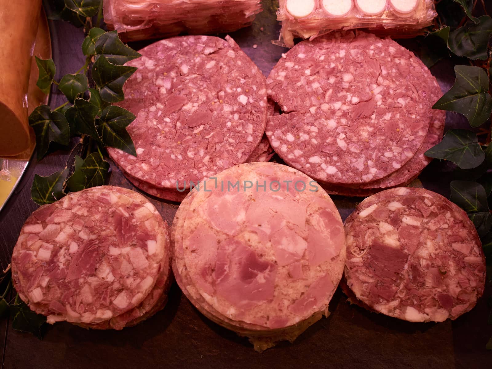 Closeup of a selection of freshly cut salami in a butcher shop