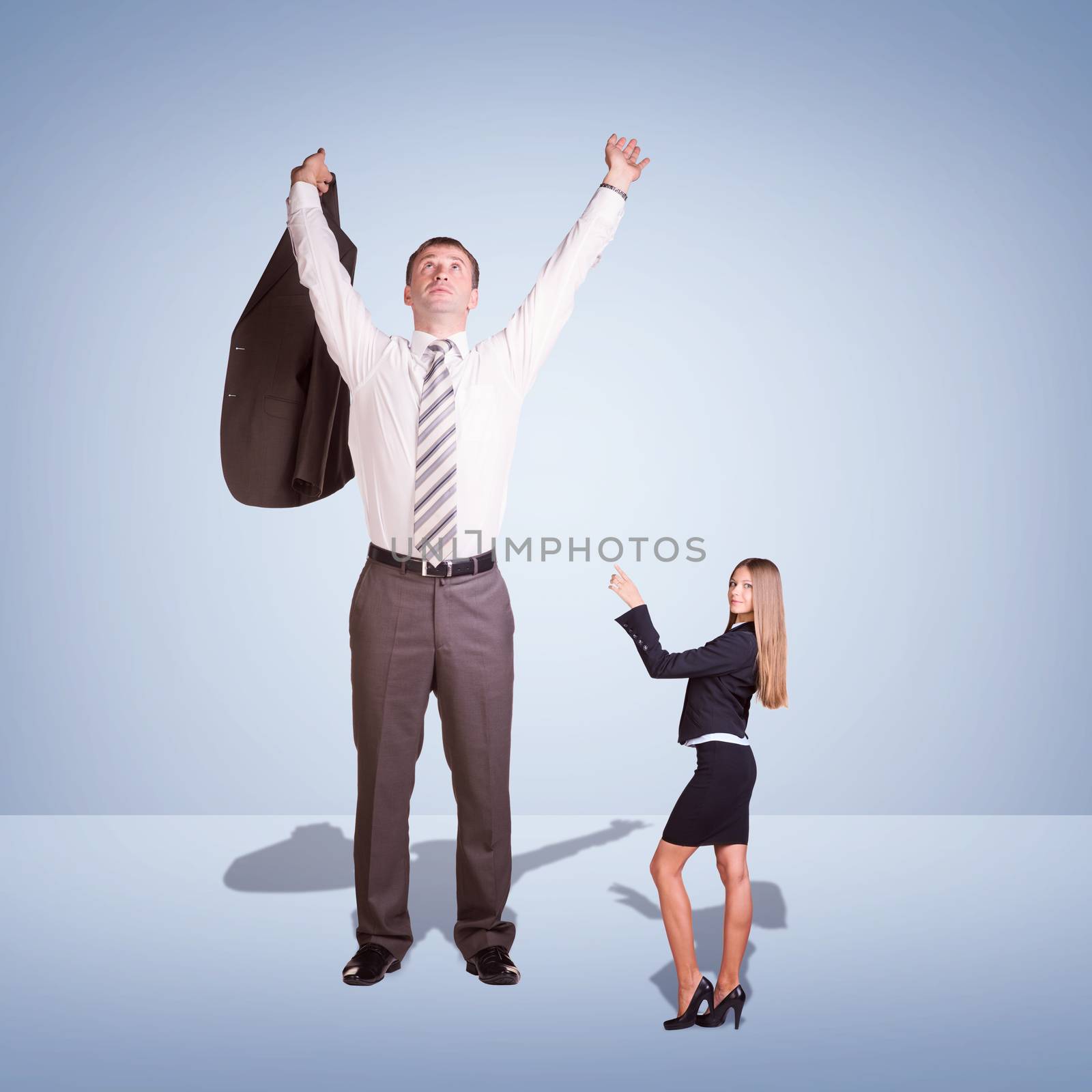 Small Young Businesswoman and Large Businessman. Blue background