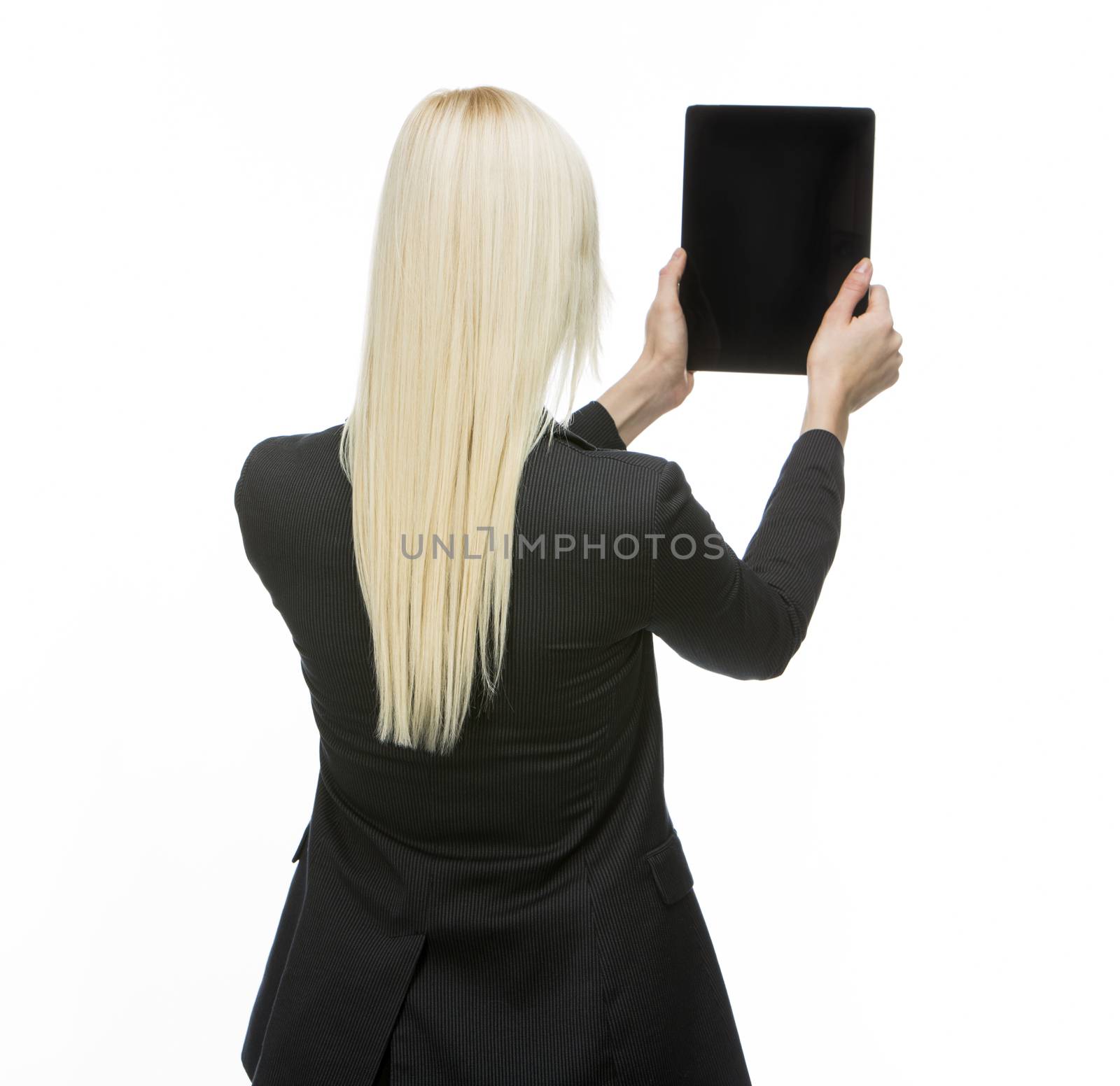 turned back blonde businesswoman holding tablet with black screen